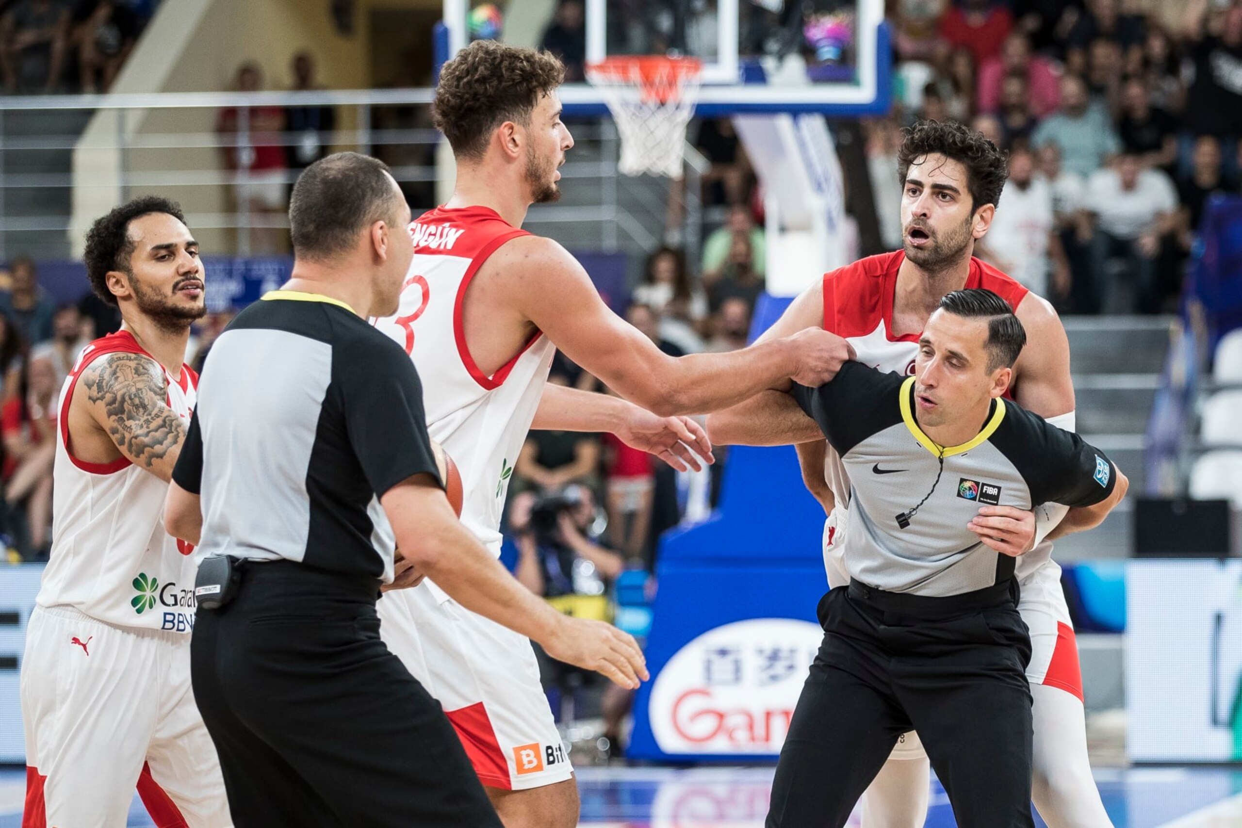 TBILISI, GEORGIA - SEPTEMBER 04: The referee protect Furkan Korkmaz of Turkey from the other players during the FIBA EuroBasket 2022 group A match between Turkey and Georgia at Tbilisi Arena on September 4, 2022 in Tbilisi, Georgia. (Photo by Nikola Krstic/MB Media/Getty Images) TBILISI, GEORGIA - SEPTEMBER 04: The referee protect Furkan Korkmaz of Turkey from the other players during the FIBA EuroBasket 2022 group A match between Turkey and Georgia at Tbilisi Arena on September 4, 2022 in Tbilisi, Georgia. (Photo by Nikola Krstic/MB Media/Getty Images)