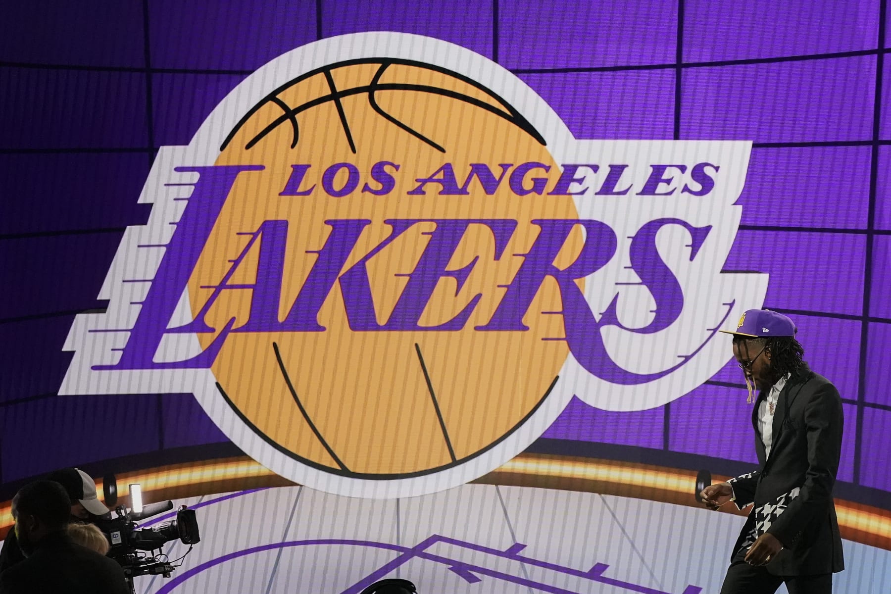 Isaiah Jackson walks off the stage after being selected 22nd overall by the Los Angeles Lakers during the NBA basketball draft, Thursday, July 29, 2021, in New York. (AP Photo/Corey Sipkin)