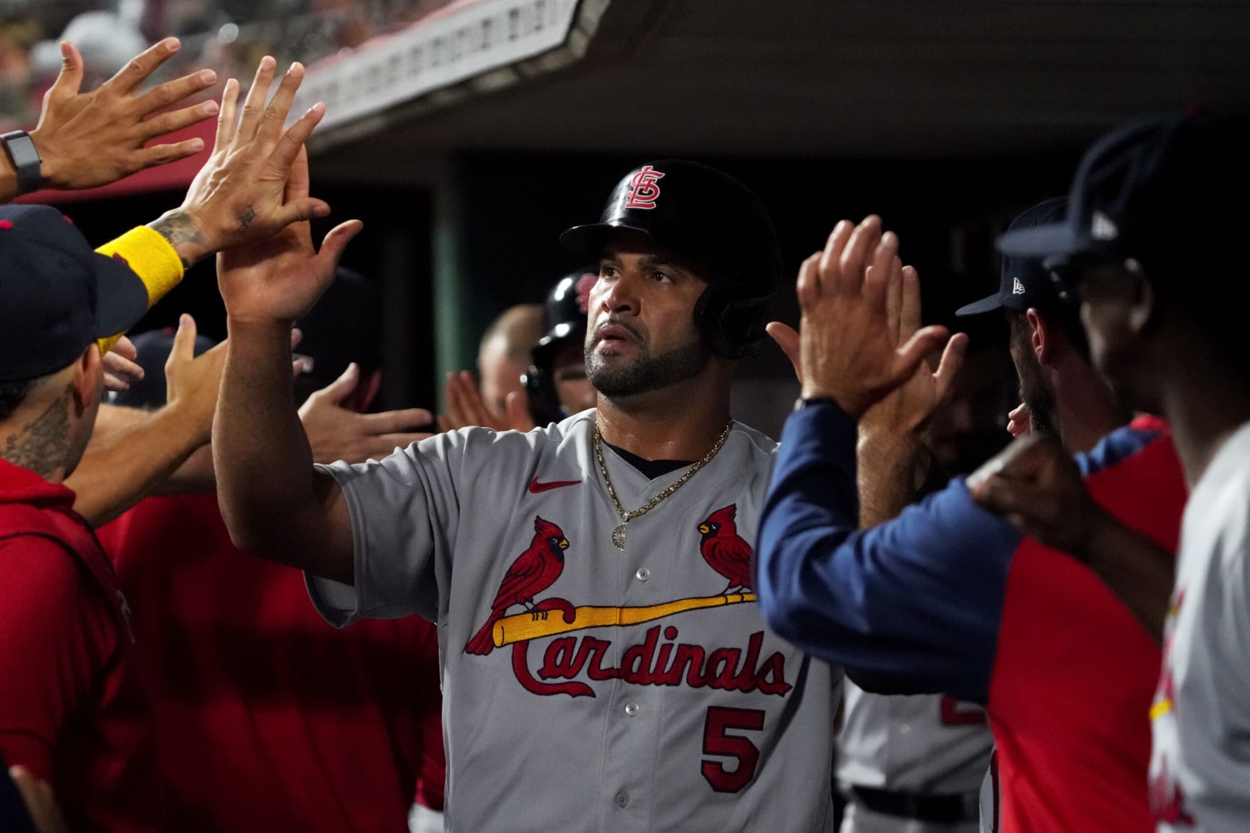CINCINNATI, OHIO - AUGUST 29: Albert Pujols #5 of the St. Louis Cardinals celebrates scoring a run in the second inning against the Cincinnati Reds at Great American Ball Park on August 29, 2022 in Cincinnati, Ohio. (Photo by Dylan Buell/Getty Images)