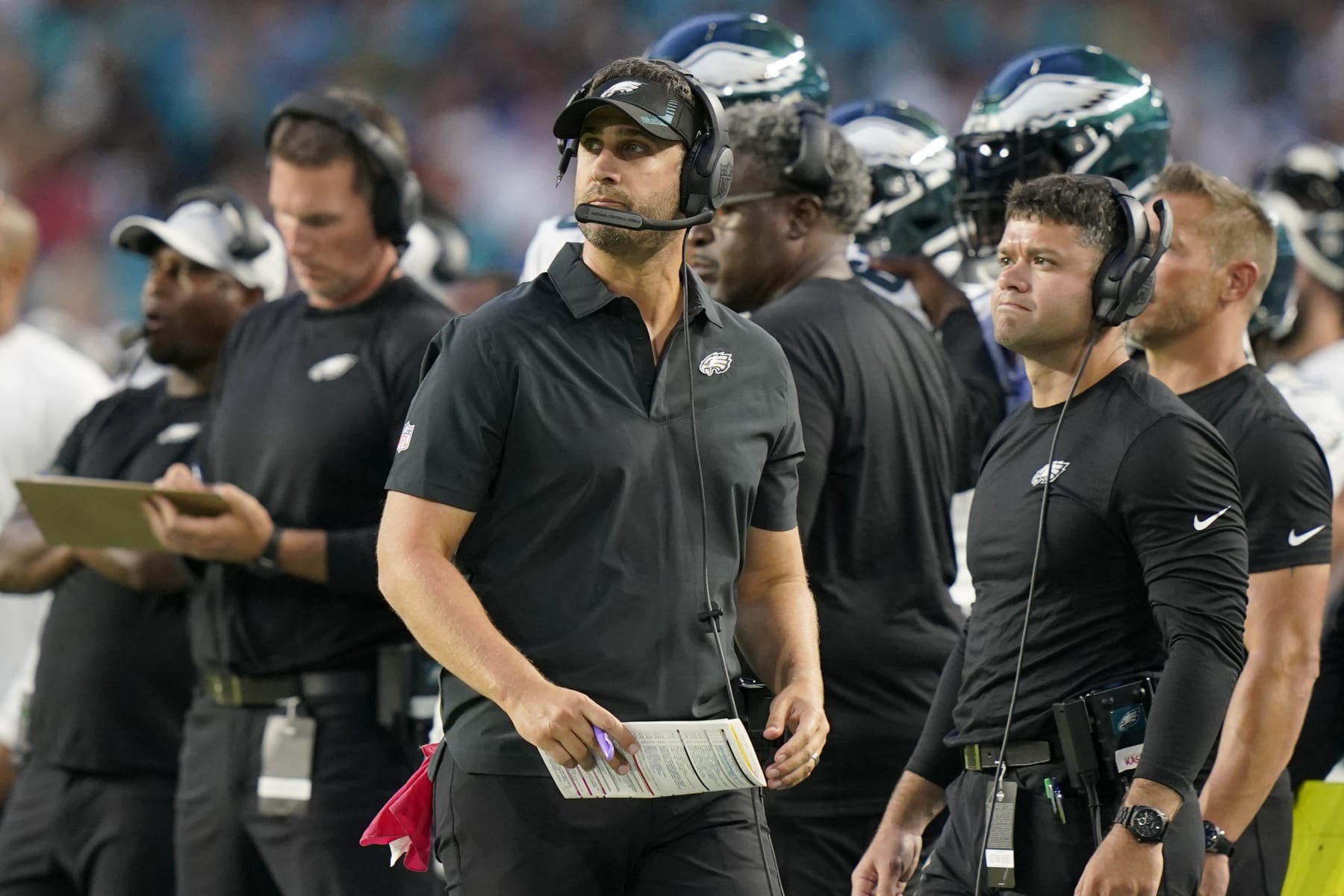 Philadelphia Eagles head coach Nick Sirianni, center, walks along the sideline during the first half of a NFL preseason football game, Saturday, Aug. 27, 2022, in Miami Gardens, Fla. (AP Photo/Lynne Sladky)