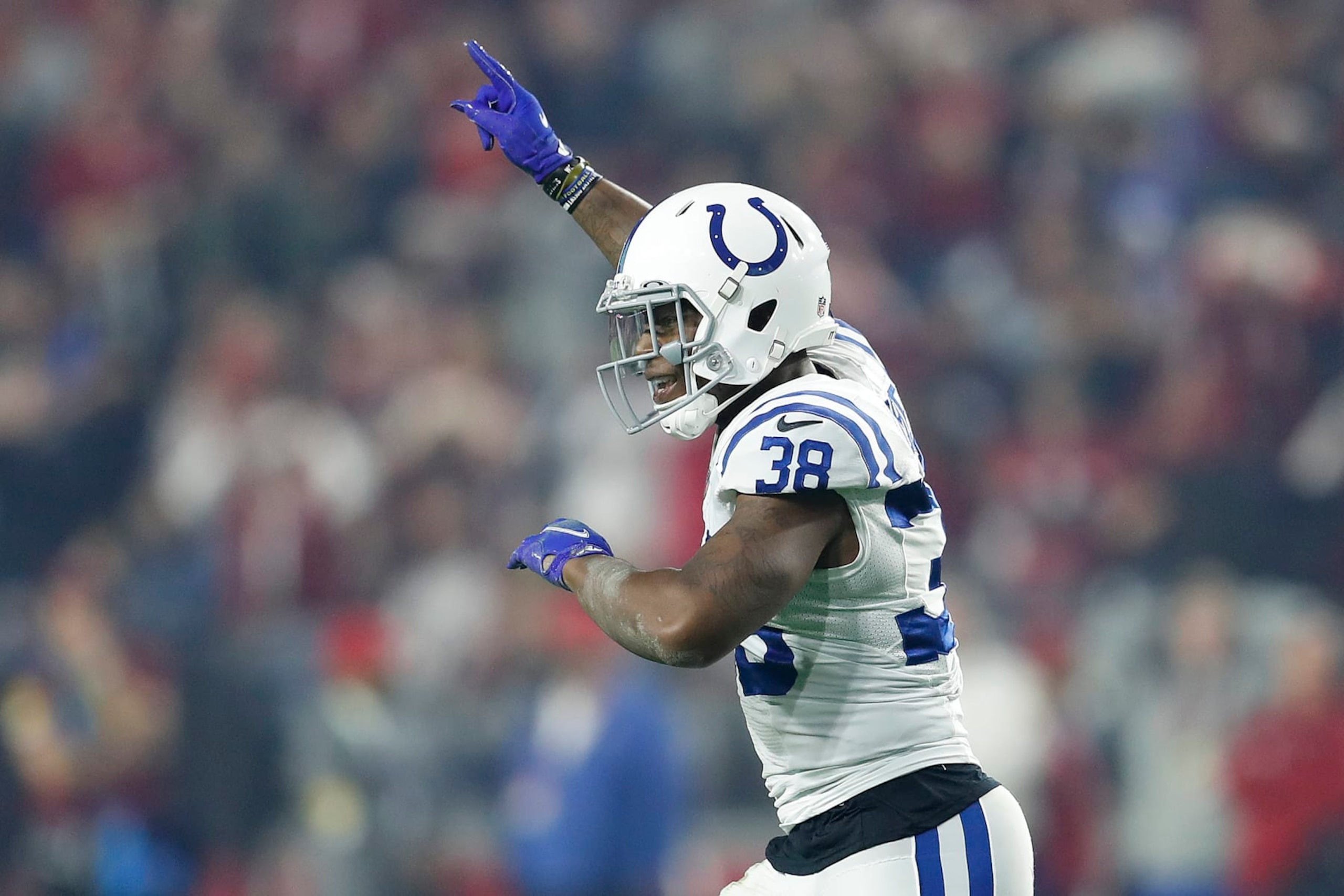 GLENDALE, ARIZONA - DECEMBER 25: T.J. Carrie #38 of the Indianapolis Colts celebrates a missed field goal by the Arizona Cardinals during the fourth quarter at State Farm Stadium on December 25, 2021 in Glendale, Arizona. (Photo by Chris Coduto/Getty Images)