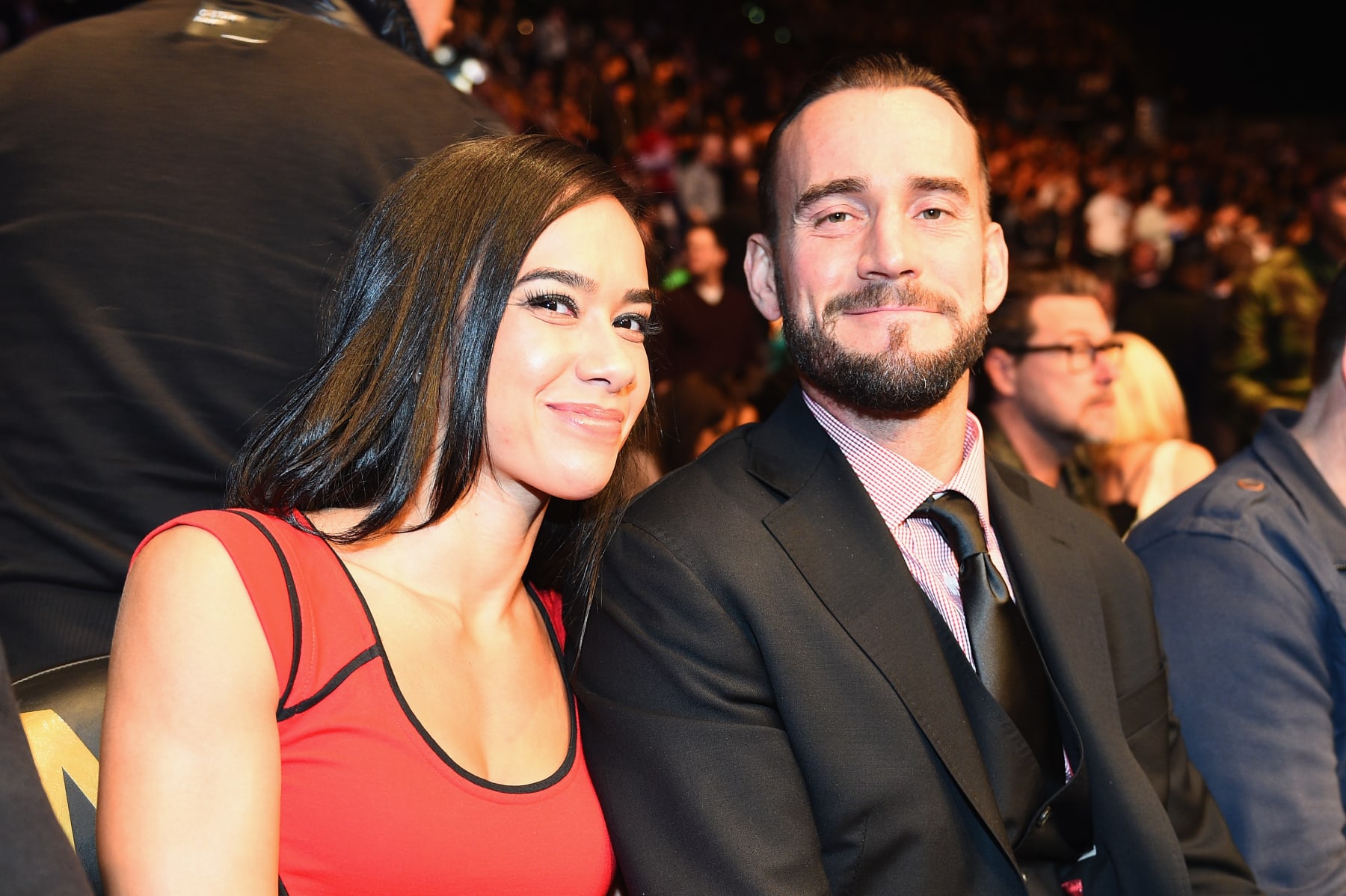 LAS VEGAS, NV - JANUARY 03:  Phil 
'CM Punk' Brooks (R) with wife AJ Lee (L) attends UFC 182 event at the MGM Grand Garden Arena on January 3, 2015 in Las Vegas, Nevada.  (Photo by Jeff Bottari/Zuffa LLC/Zuffa LLC via Getty Images)