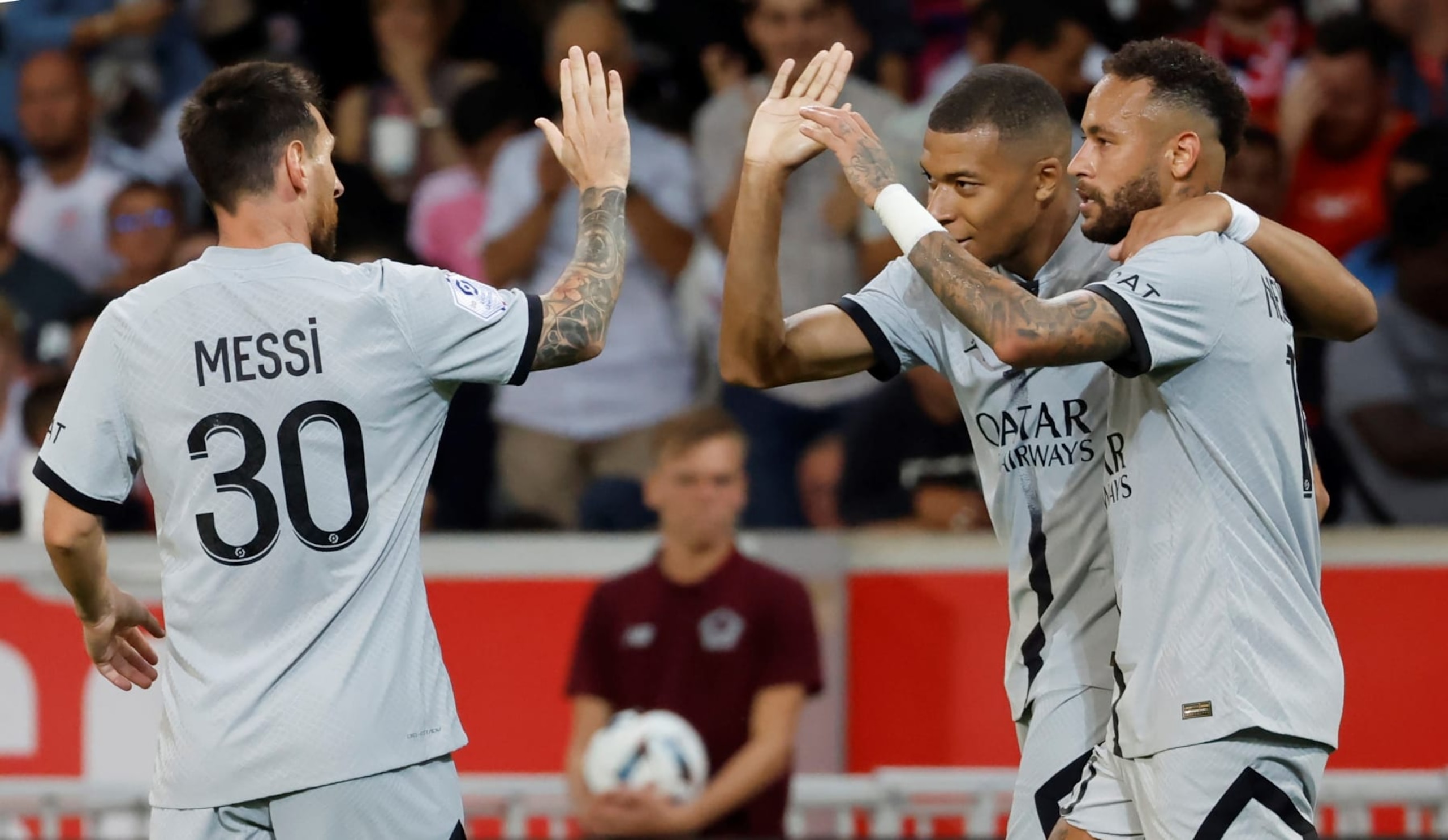 Paris Saint-Germain's Lionel Messi, Kylian Mbappe and Neymar L to R celebrate scoring during a French Ligue 1 football match between Lille and Paris Saint-Germain PSG at Stade Pierre-Mauroy in Villeneuve-d'Asq, northern France, Aug. 21, 2022. (Photo by Rit Heize/Xinhua via Getty Images)