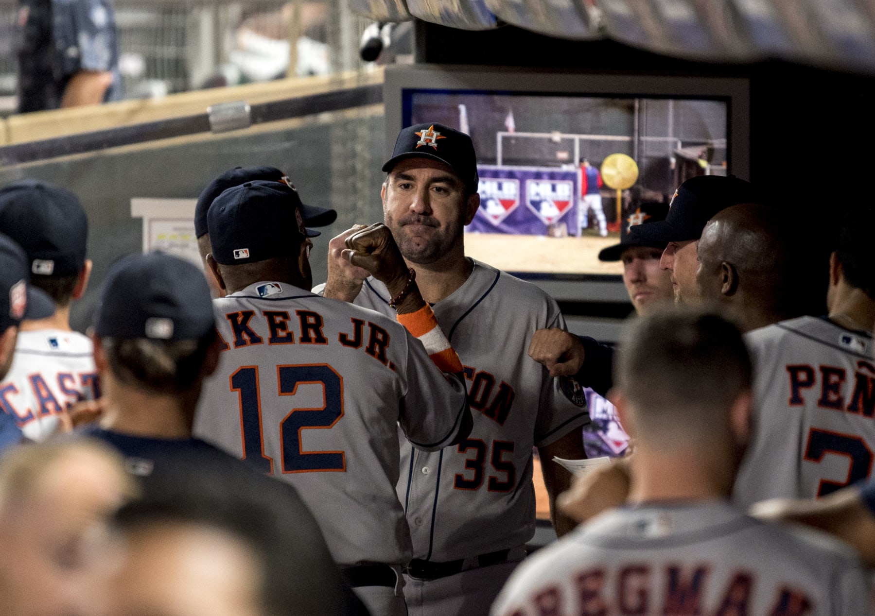 MINNEAPOLIS, MN - MAY 10: Justin Verlander #35 is greeted by manager Dusty Baker Jr. #12 of the Houston Astros in the dugout after having a no-hitter broken up in the eighth inning of the game against the Minnesota Twins at Target Field on May 10, 2022 in Minneapolis, Minnesota. (Photo by Stephen Maturen/Getty Images)