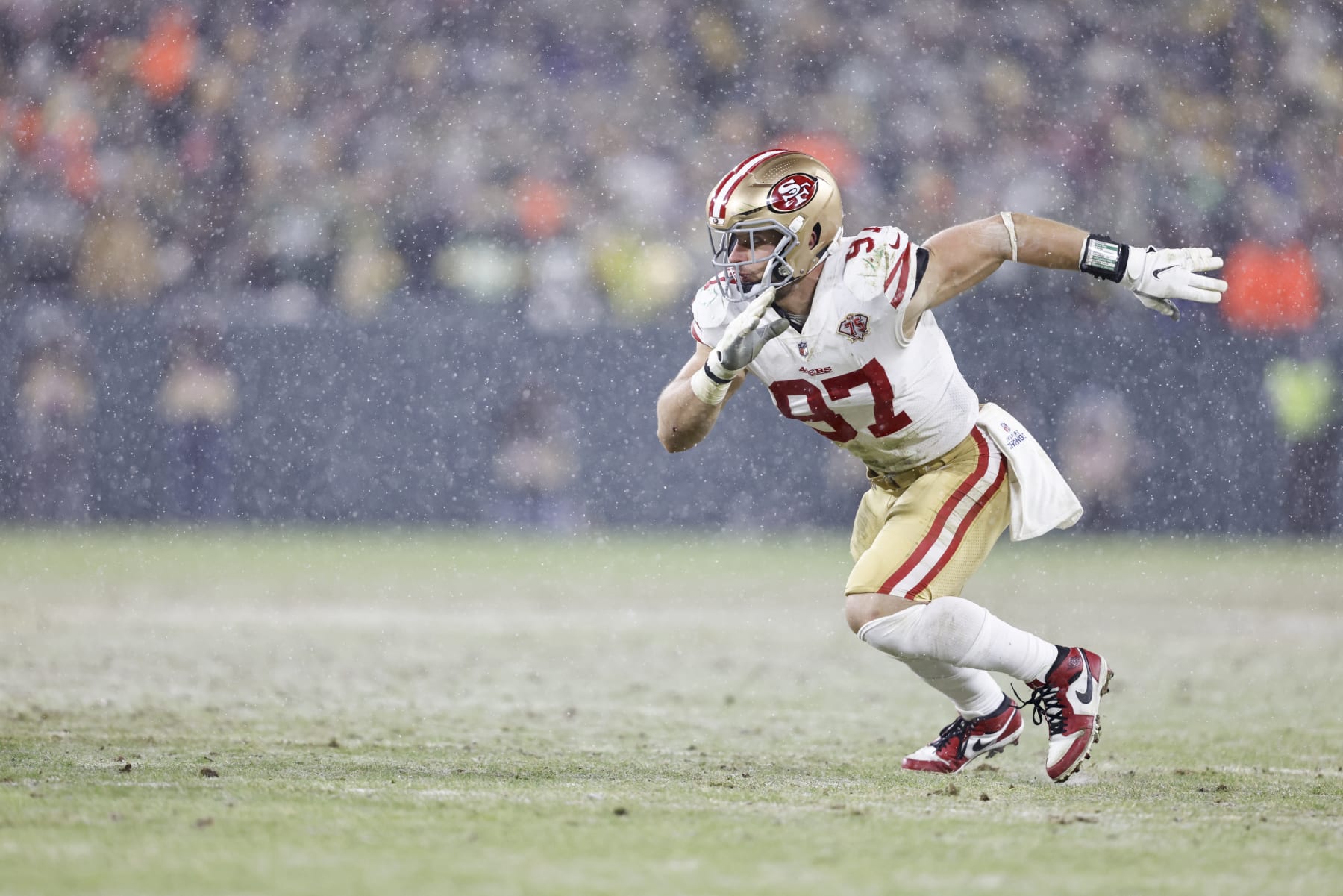 GREEN BAY, WISCONSIN - JANUARY 22: Nick Bosa #97 of the San Francisco 49ers runs and defends during an NFL divisional playoff football game against the Green Bay Packers at Lambeau Field on January 22, 2022 in Green Bay, Wisconsin. The 49ers won 13-10. (Photo by Michael Owens/Getty Images)