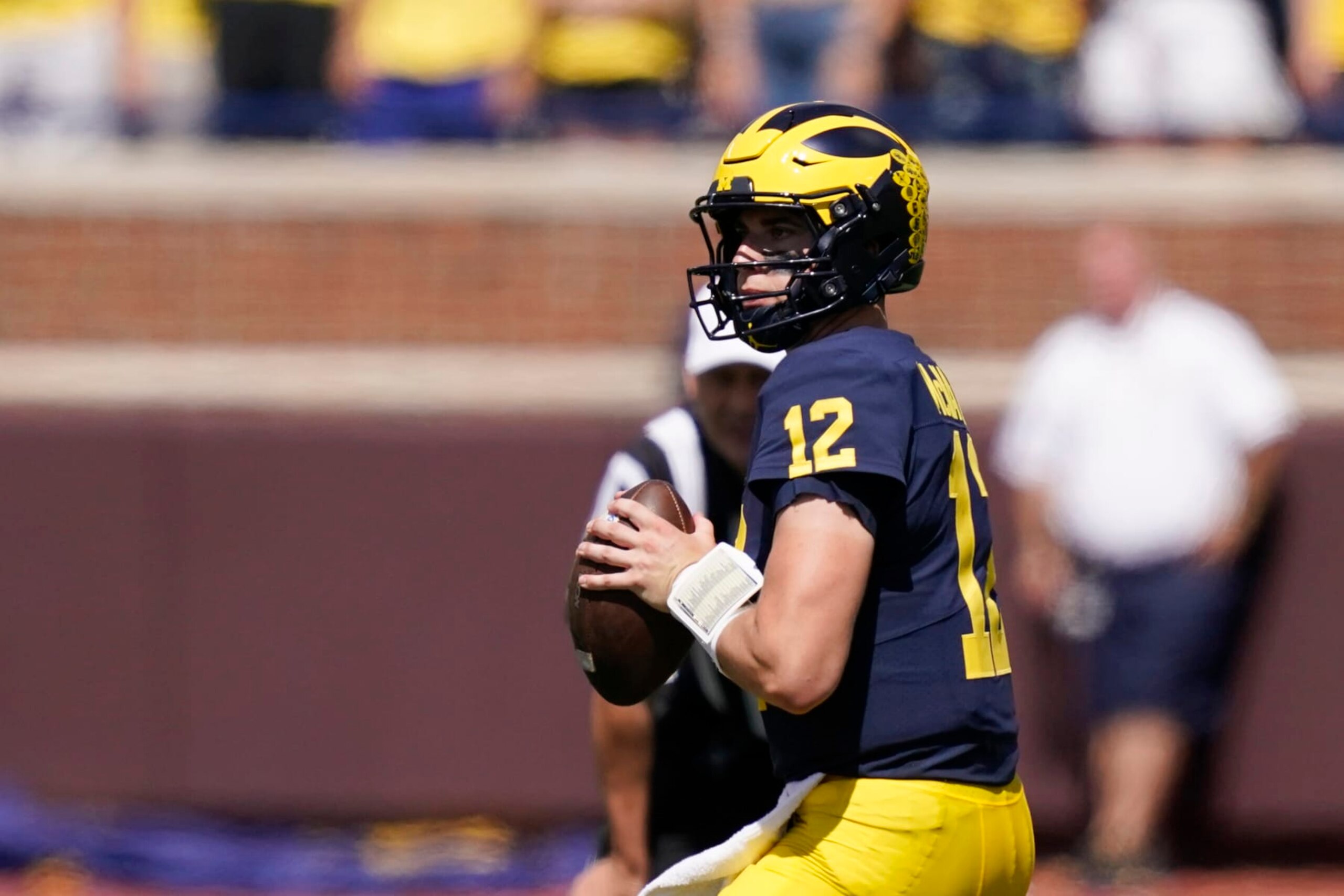 Michigan quarterback Cade McNamara looks downfield during the first half of an NCAA college football game against Colorado State, Saturday, Sept. 3, 2022, in Ann Arbor, Mich. McNamara had a lackluster performance that was made moot by a dominant defense as No. 8 Michigan routed Colorado State 51-7. The Big Ten championship winning quarterback started the opener and is scheduled to sit at the beginning of the Hawaii game next week when J.J. McCarthy gets a shot to take the first snap. (AP Photo/Carlos Osorio)