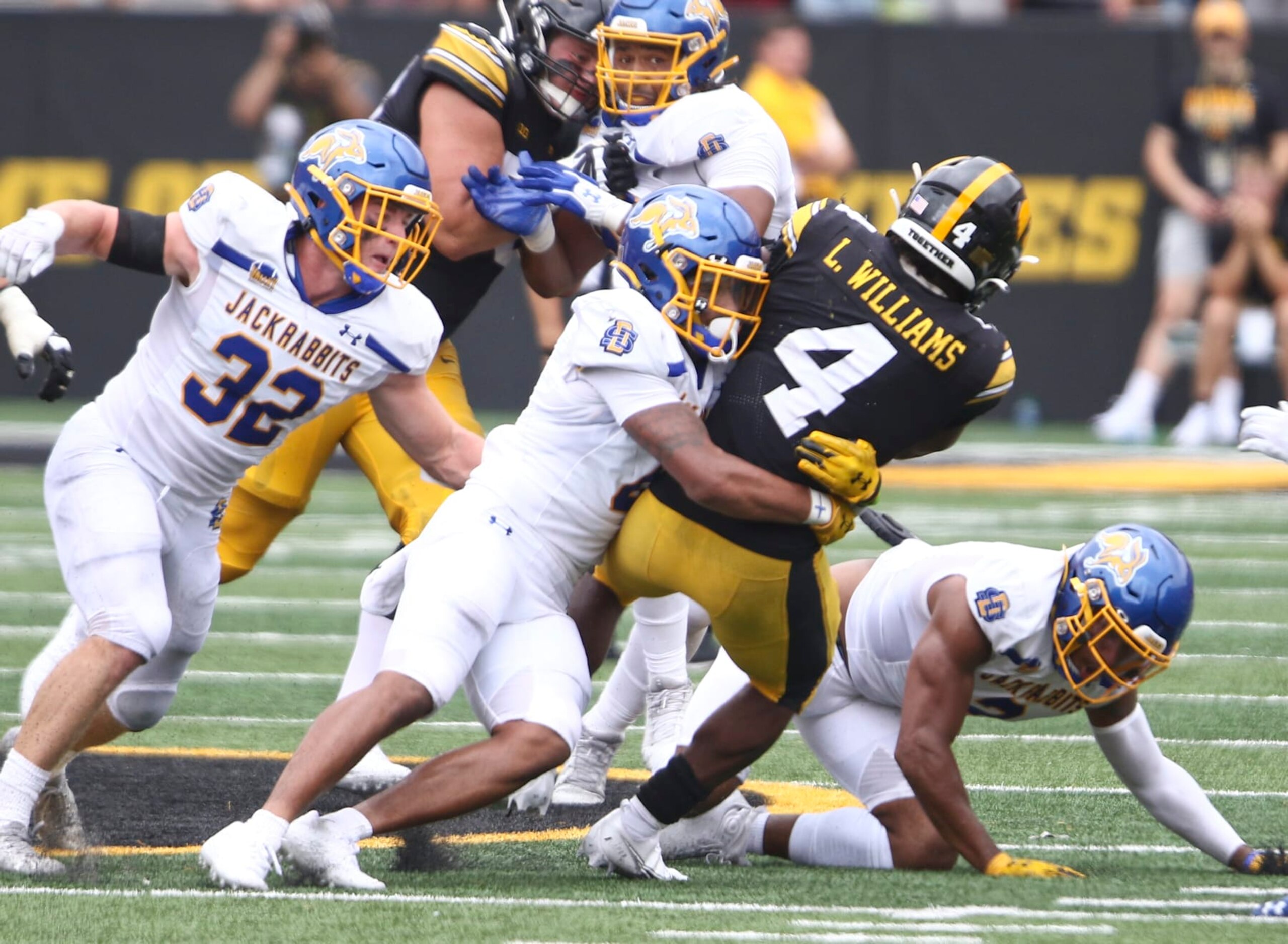 IOWA CITY, IOWA- SEPTEMBER 03:  Running back Leshon Williams #4 of the Iowa Hawkeyes is brought down during the second half by linebacker Isaiah Stalbird #2 ofthe South Dakota State Jackrabbits at Kinnick Stadium on September 03, 2022 in Iowa City, Iowa.  (Photo by Matthew Holst/Getty Images)