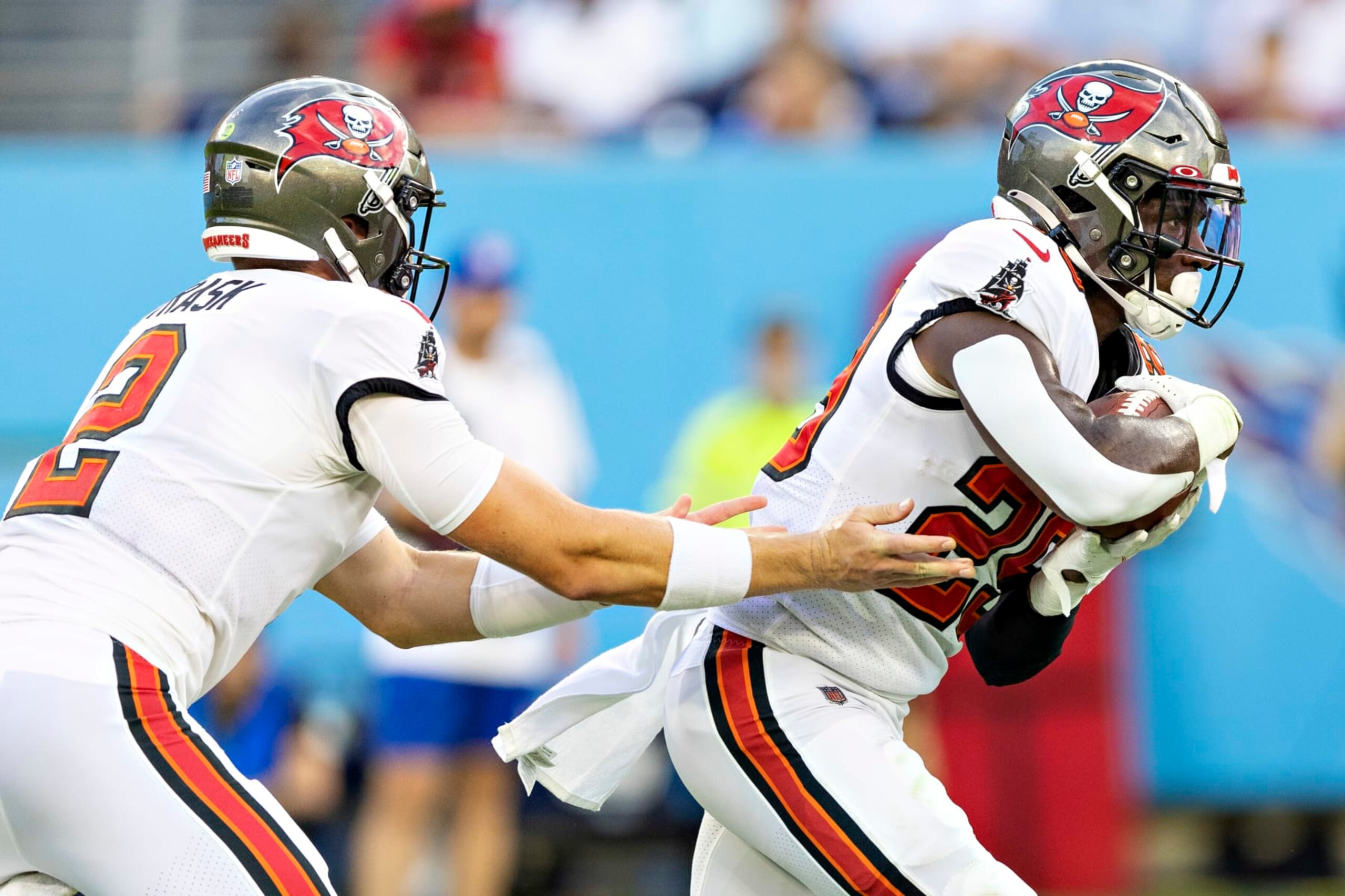 NASHVILLE, TENNESSEE - AUGUST 20: Kyle Trask #2 hands off the ball to Rachaad White #29 of the Tampa Bay Buccaneers during a preseason game against the Tennessee Titans at Nissan Stadium on August 20, 2022 in Nashville, Tennessee. (Photo by Wesley Hitt/Getty Images) NASHVILLE, TENNESSEE - AUGUST 20: Kyle Trask #2 hands off the ball to Rachaad White #29 of the Tampa Bay Buccaneers during a preseason game against the Tennessee Titans at Nissan Stadium on August 20, 2022 in Nashville, Tennessee. (Photo by Wesley Hitt/Getty Images)