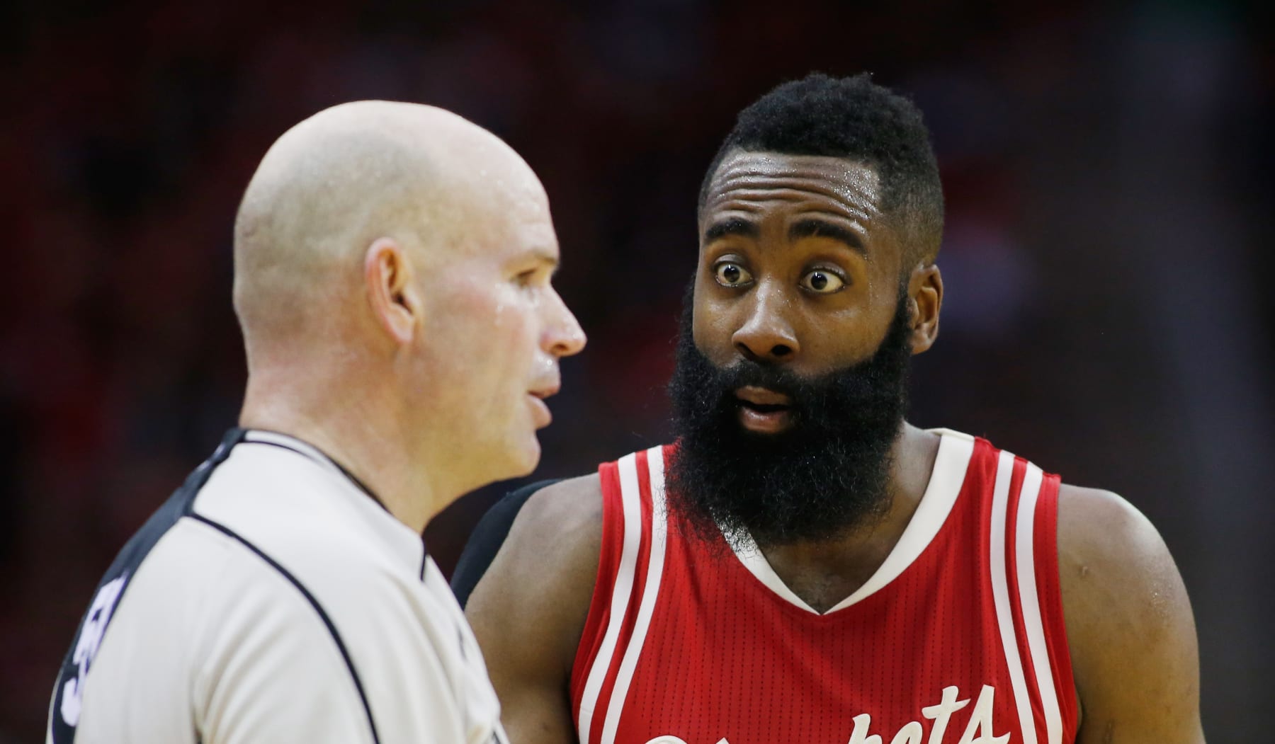 HOUSTON, TX - DECEMBER 25:  James Harden #13 of the Houston Rockets agrues a call with NBA official Gary Zielinski during their game against the San Antonio Spurs at the Toyota Center on December 25, 2015 in Houston, Texas. NOTE TO USER: User expressly acknowledges and agrees that, by downloading and or using this Photograph, user is consenting to the terms and conditions of the Getty Images License Agreement.  (Photo by Scott Halleran/Getty Images)