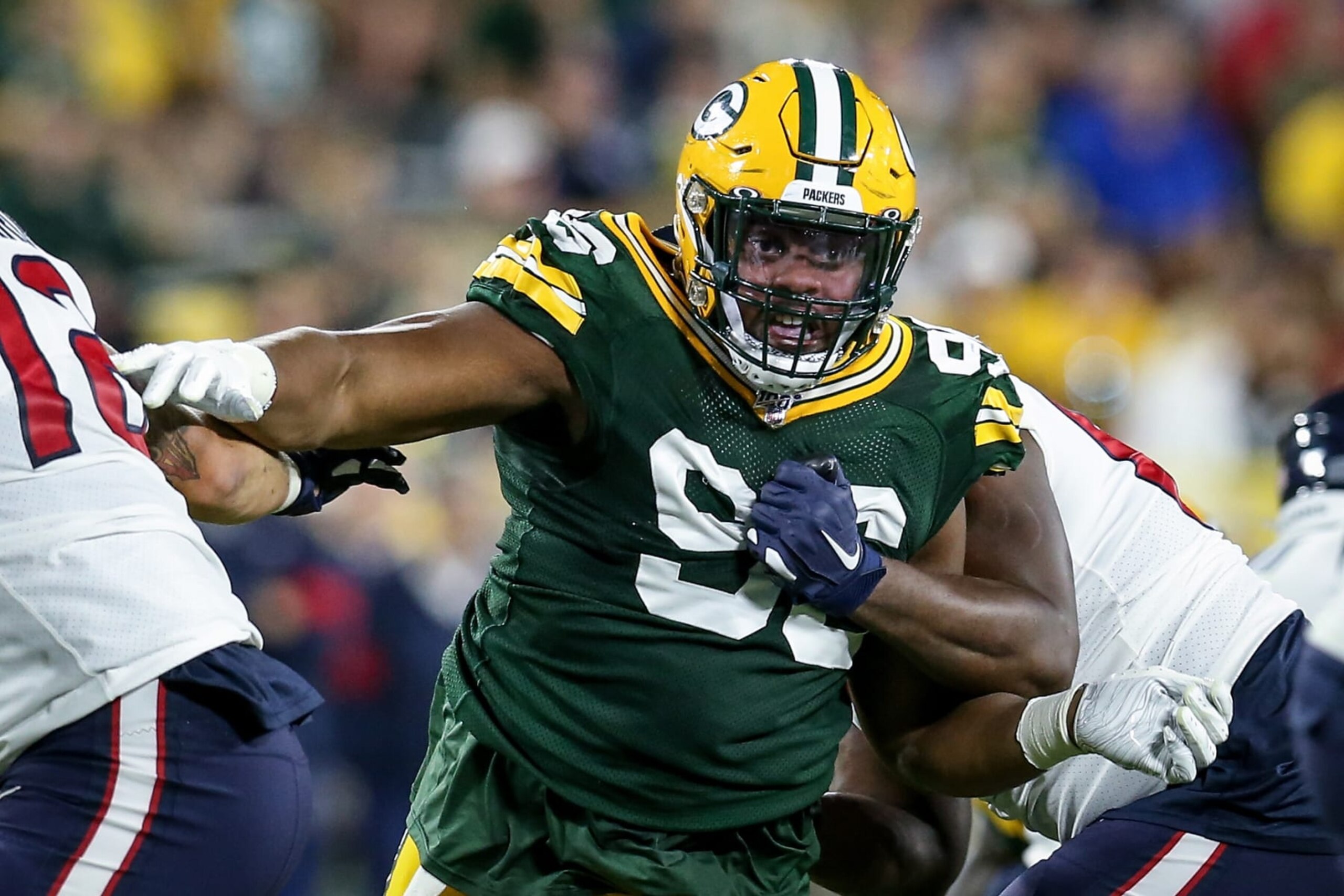 GREEN BAY, WISCONSIN - AUGUST 08:  Kingsley Keke #96 of the Green Bay Packers fights off a block by Malcolm Pridgeon #68 of the Houston Texans in the third quarter during a preseason game at Lambeau Field on August 08, 2019 in Green Bay, Wisconsin. (Photo by Dylan Buell/Getty Images)