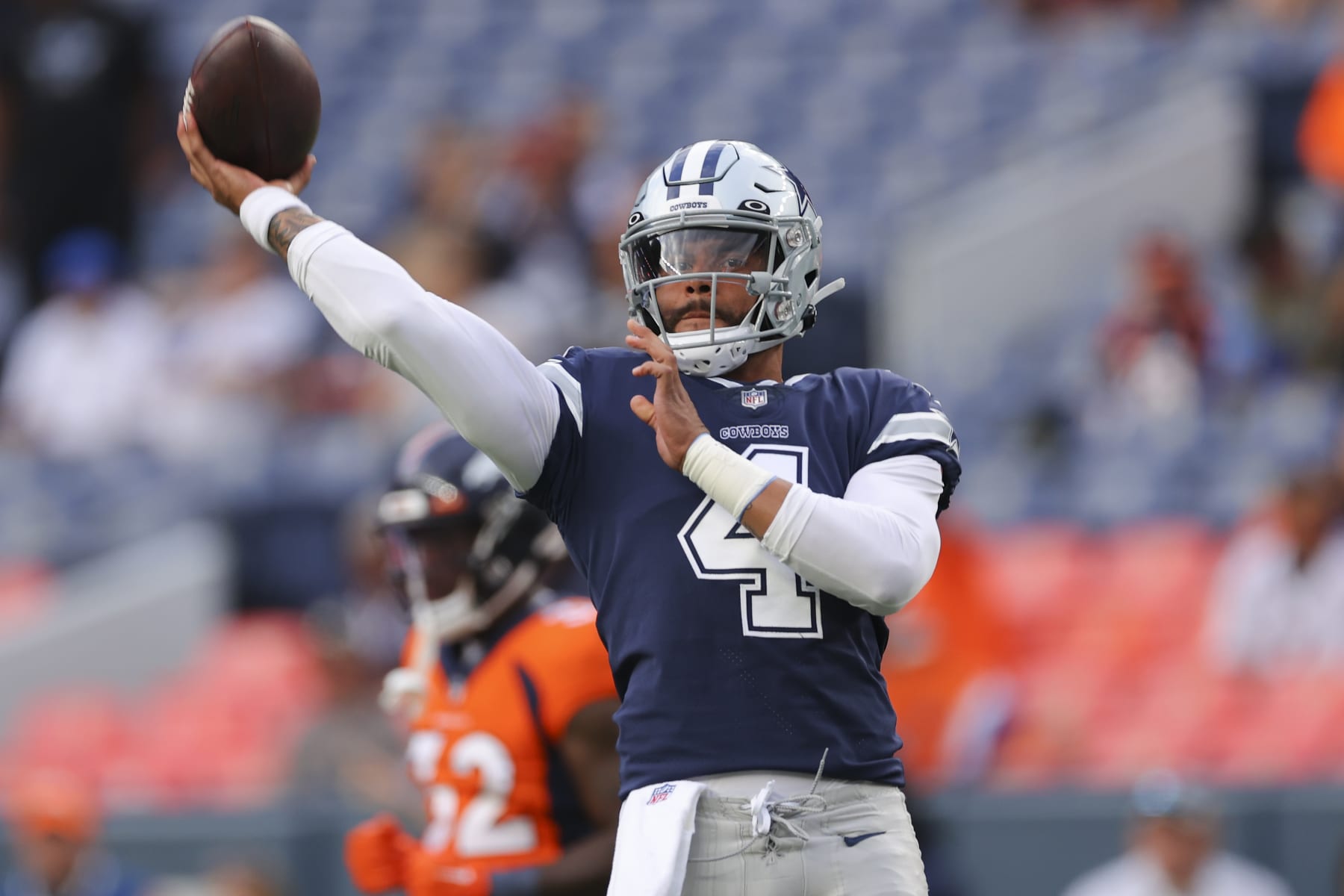 DENVER, CO - AUGUST 13: Dak Prescott #4 of the Dallas Cowboys warms up before the game against the Denver Broncosat Empower Field At Mile High on August 13, 2022 in Denver, Colorado. (Photo by C. Morgan Engel/Getty Images)