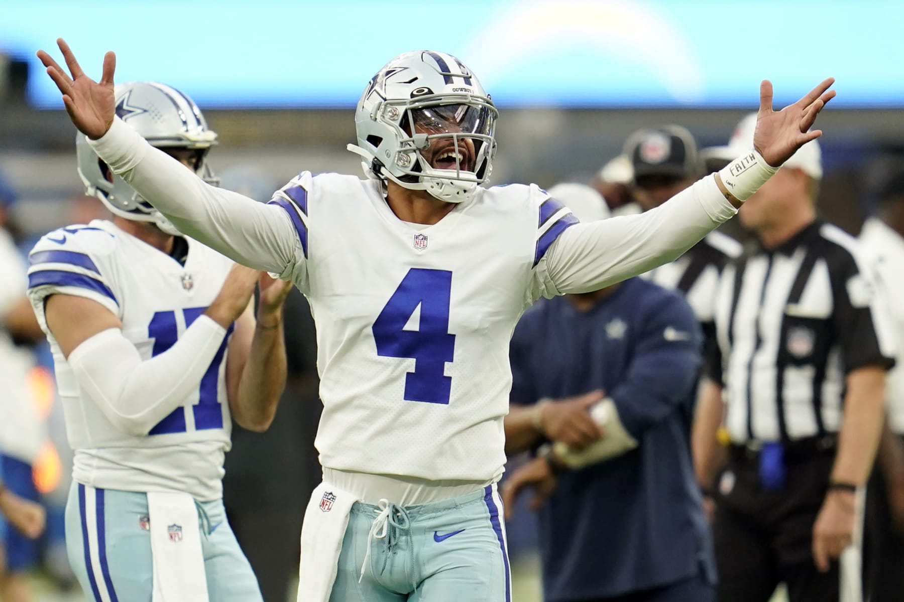 Dallas Cowboys quarterback Dak Prescott (4) gestures during warm ups before a preseason NFL football game against the Los Angeles Chargers Saturday, Aug. 20, 2022, in Inglewood, Calif. (AP Photo/Ashley Landis)
