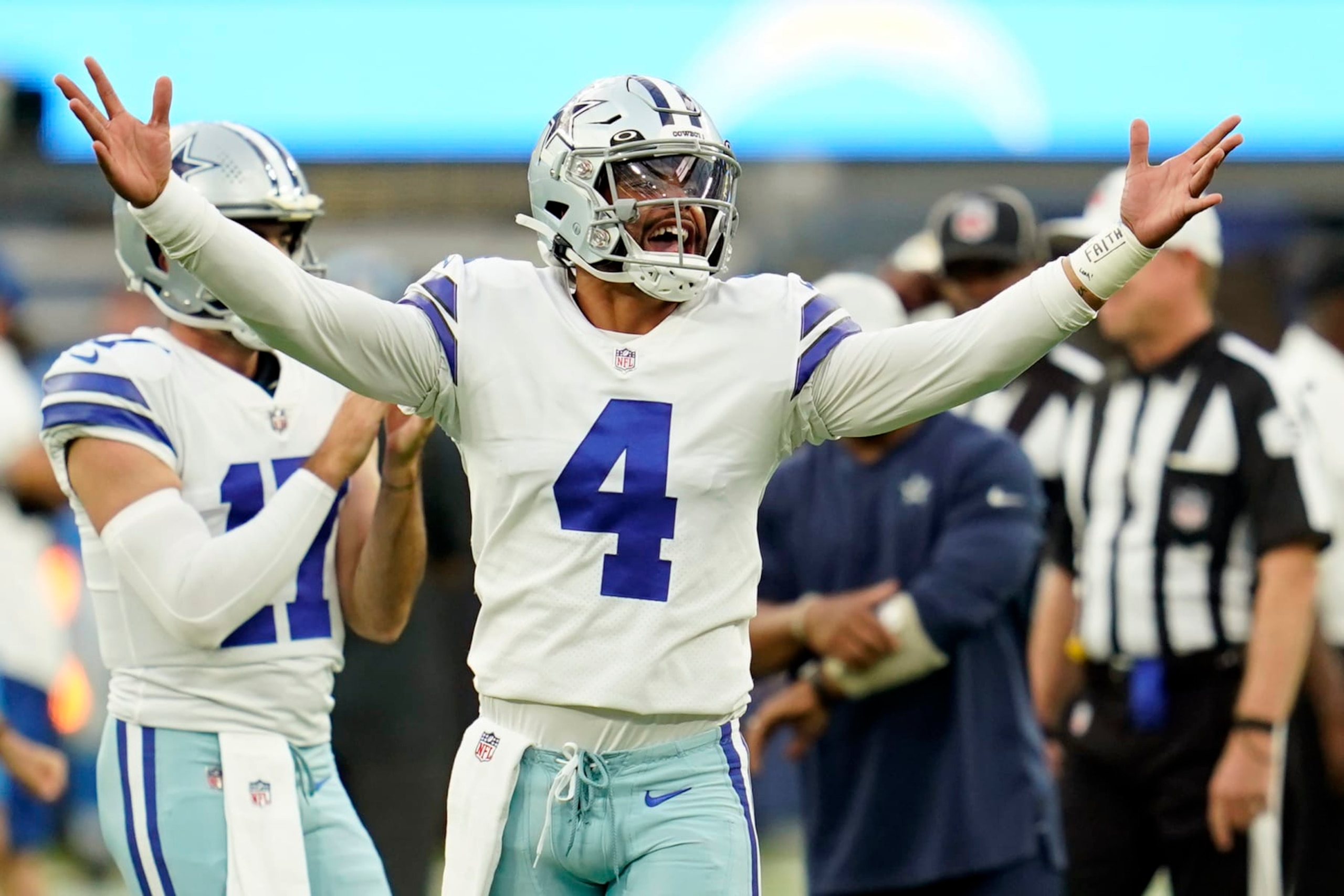 Dallas Cowboys quarterback Dak Prescott (4) gestures during warm ups before a preseason NFL football game against the Los Angeles Chargers Saturday, Aug. 20, 2022, in Inglewood, Calif. (AP Photo/Ashley Landis)