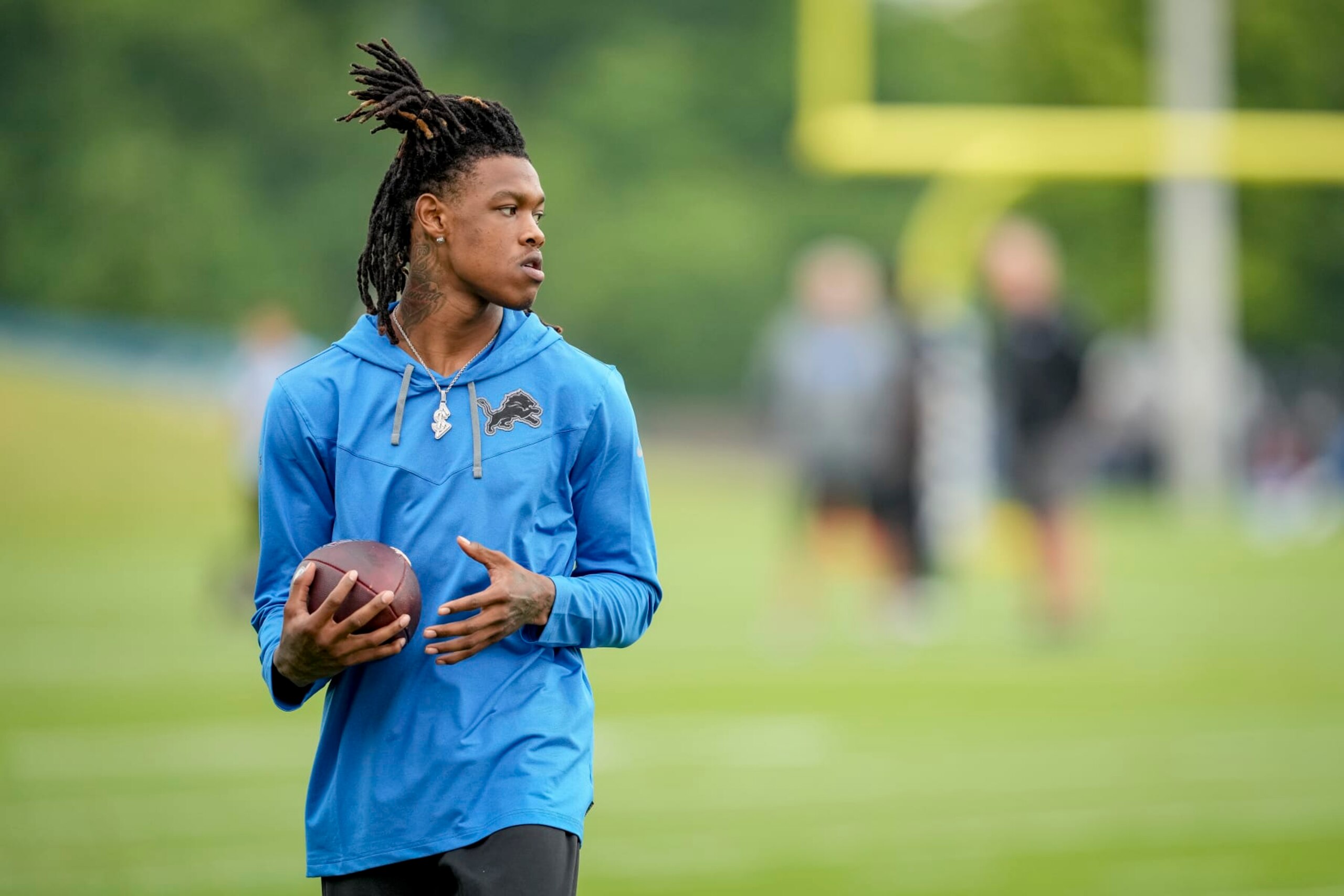ALLEN PARK, MICHIGAN - JULY 27: Jameson Williams #18 of the Detroit Lions looks on during the Detroit Lions Training Camp on July 27, 2022 at the Lions Headquarters and Training Facility in Allen Park, Michigan. (Photo by Nic Antaya/Getty Images)