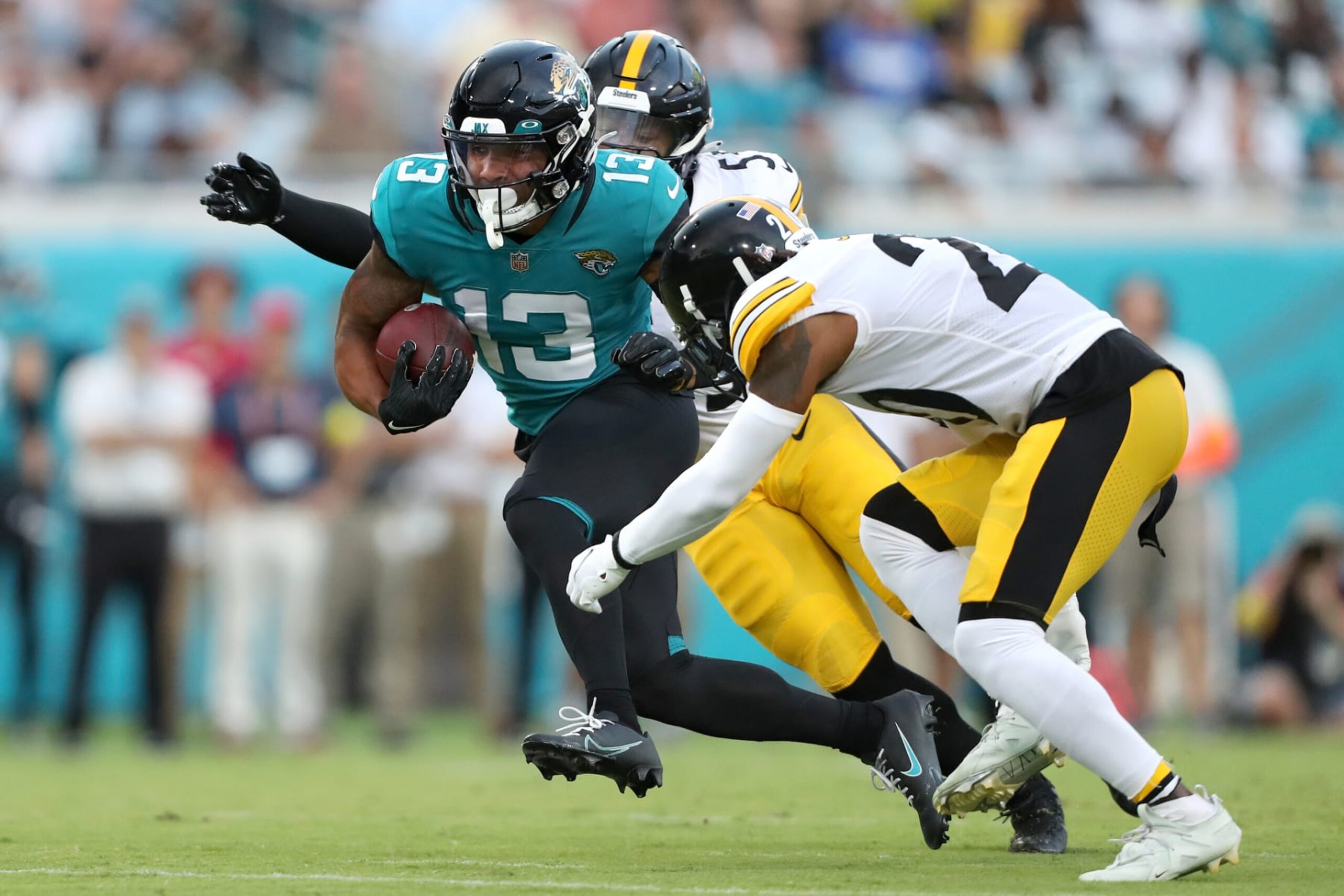 JACKSONVILLE, FLORIDA - AUGUST 20: Christian Kirk #13 of the Jacksonville Jaguars catches a pass in the first half against the Pittsburgh Steelers at TIAA Bank Field on August 20, 2022 in Jacksonville, Florida. (Photo by Courtney Culbreath/Getty Images)