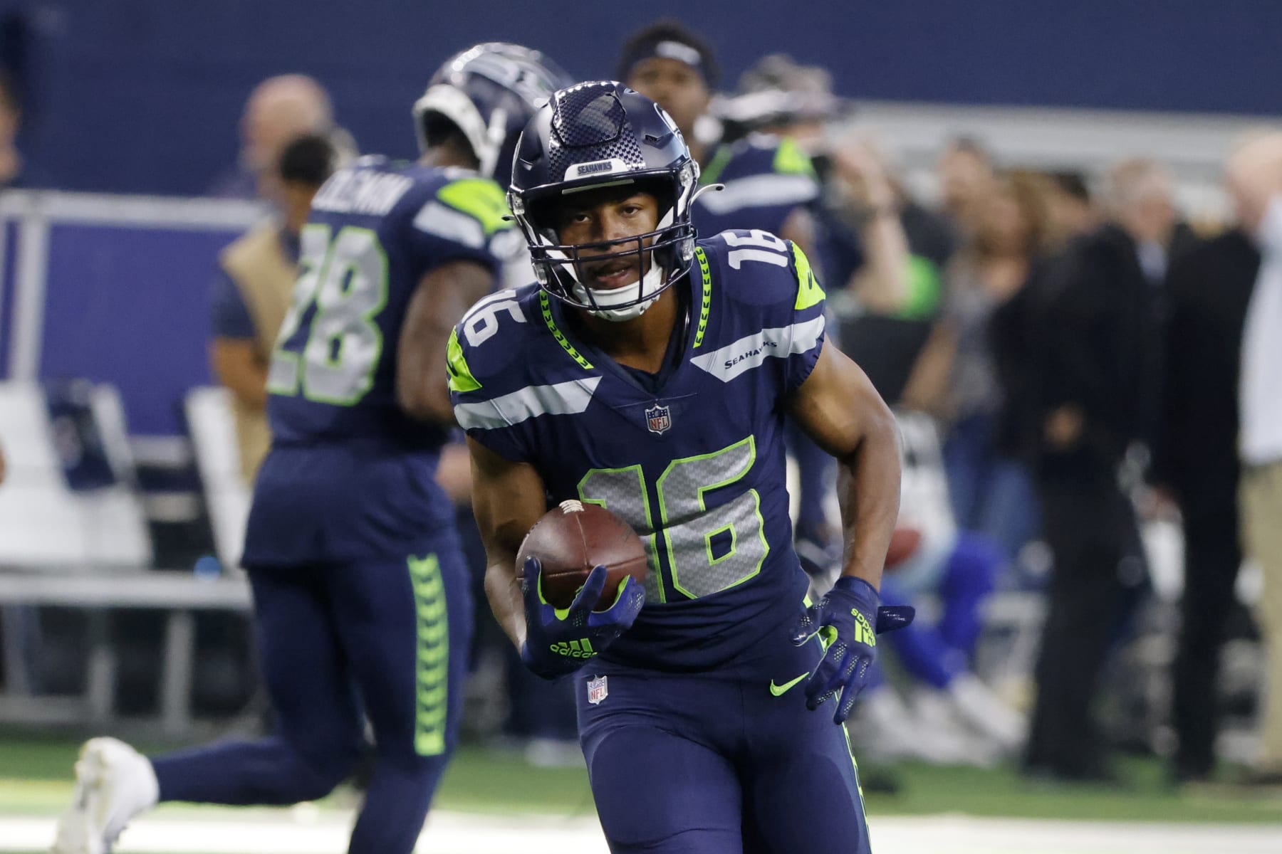Seattle Seahawks wide receiver Tyler Lockett (16) warms up prior to a preseason NFL Football game in Arlington, Texas, Friday, Aug. 27, 2022. (AP Photo/Michael Ainsworth)