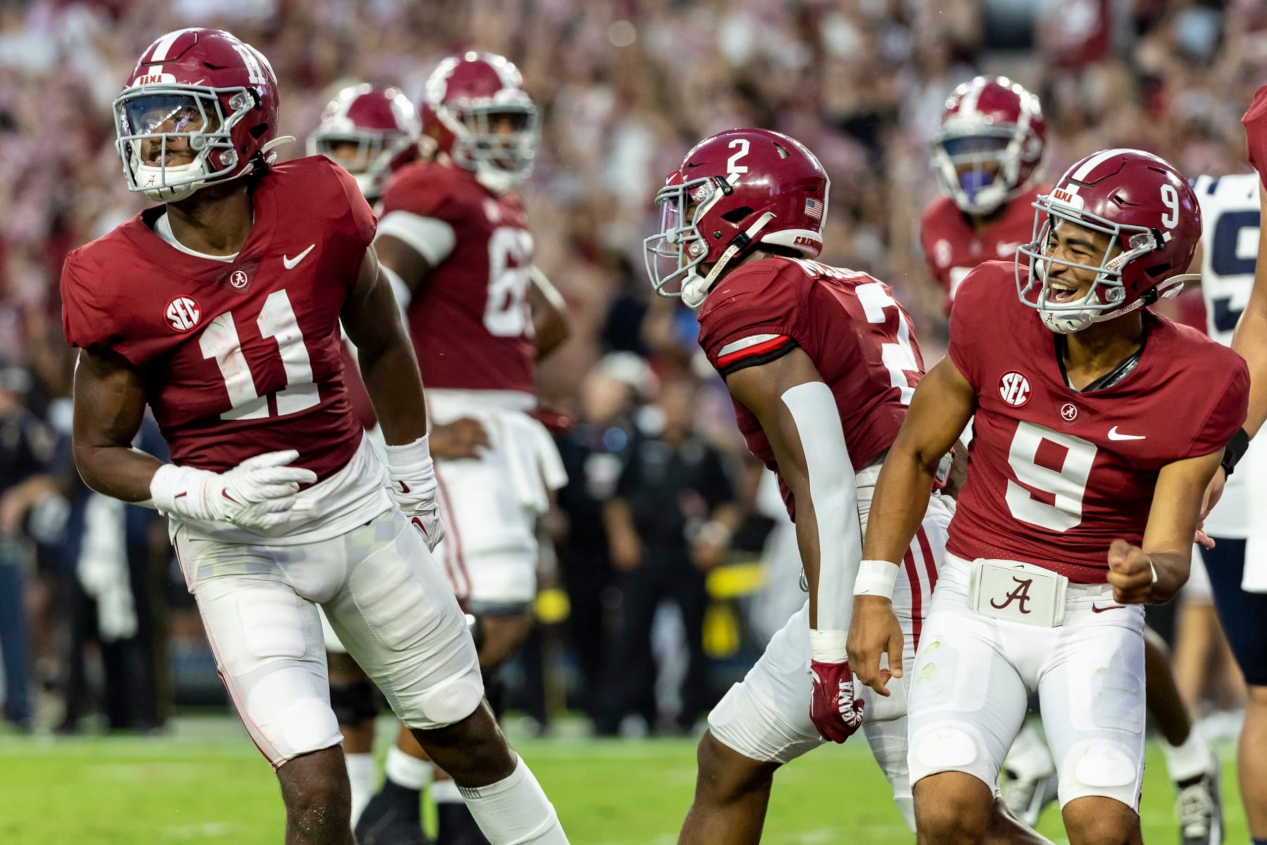 Alabama wide receiver Traeshon Holden (11) and quarterback Bryce Young (9) celebrate after combining on a touchdown pass during the first half of an NCAA college football game against Utah State, Saturday, Sept. 3, 2022, in Tuscaloosa, Ala. (AP Photo/Vasha Hunt) Alabama wide receiver Traeshon Holden (11) and quarterback Bryce Young (9) celebrate after combining on a touchdown pass during the first half of an NCAA college football game against Utah State, Saturday, Sept. 3, 2022, in Tuscaloosa, Ala. (AP Photo/Vasha Hunt)