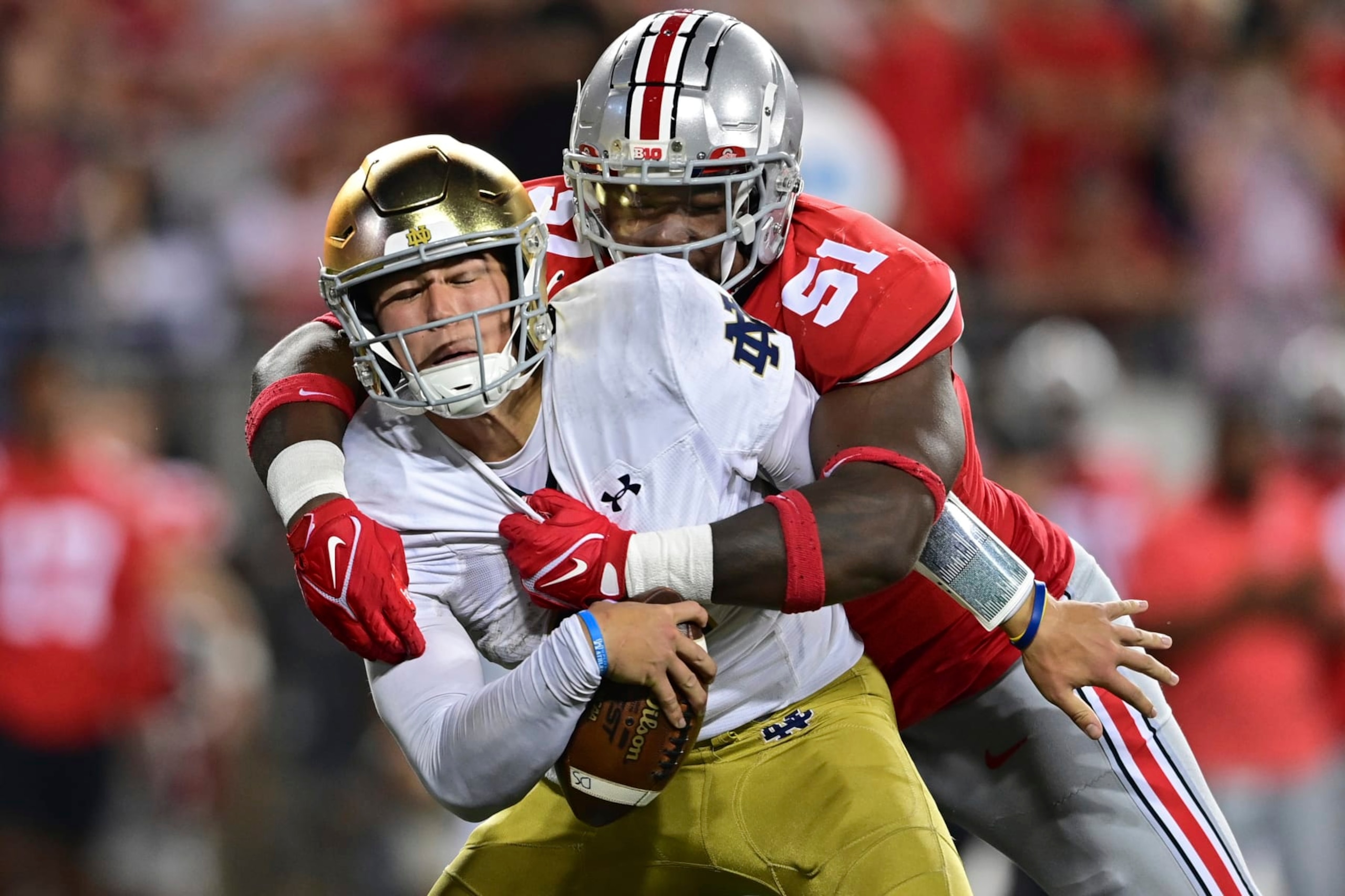 Notre Dame quarterback Tyler Buchner is sacked by Ohio State defensive tackle Michael Hall Jr. during the fourth quarter of an NCAA college football game Saturday, Sept. 3, 2022, in Columbus, Ohio. (AP Photo/David Dermer) Notre Dame quarterback Tyler Buchner is sacked by Ohio State defensive tackle Michael Hall Jr. during the fourth quarter of an NCAA college football game Saturday, Sept. 3, 2022, in Columbus, Ohio. (AP Photo/David Dermer)