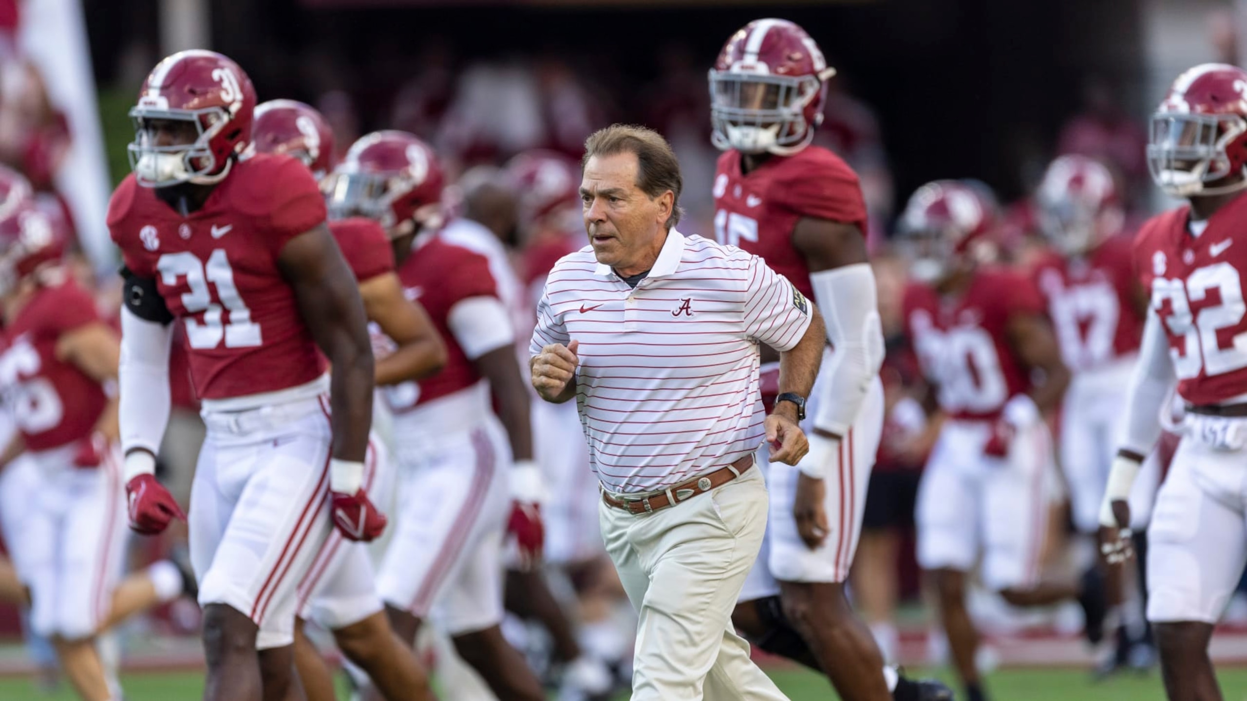 Alabama head coach Nick Saban leads his team onto the field before an NCAA college football game against Utah State, Saturday, Sept. 3, 2022, in Tuscaloosa, Ala. (AP Photo/Vasha Hunt)