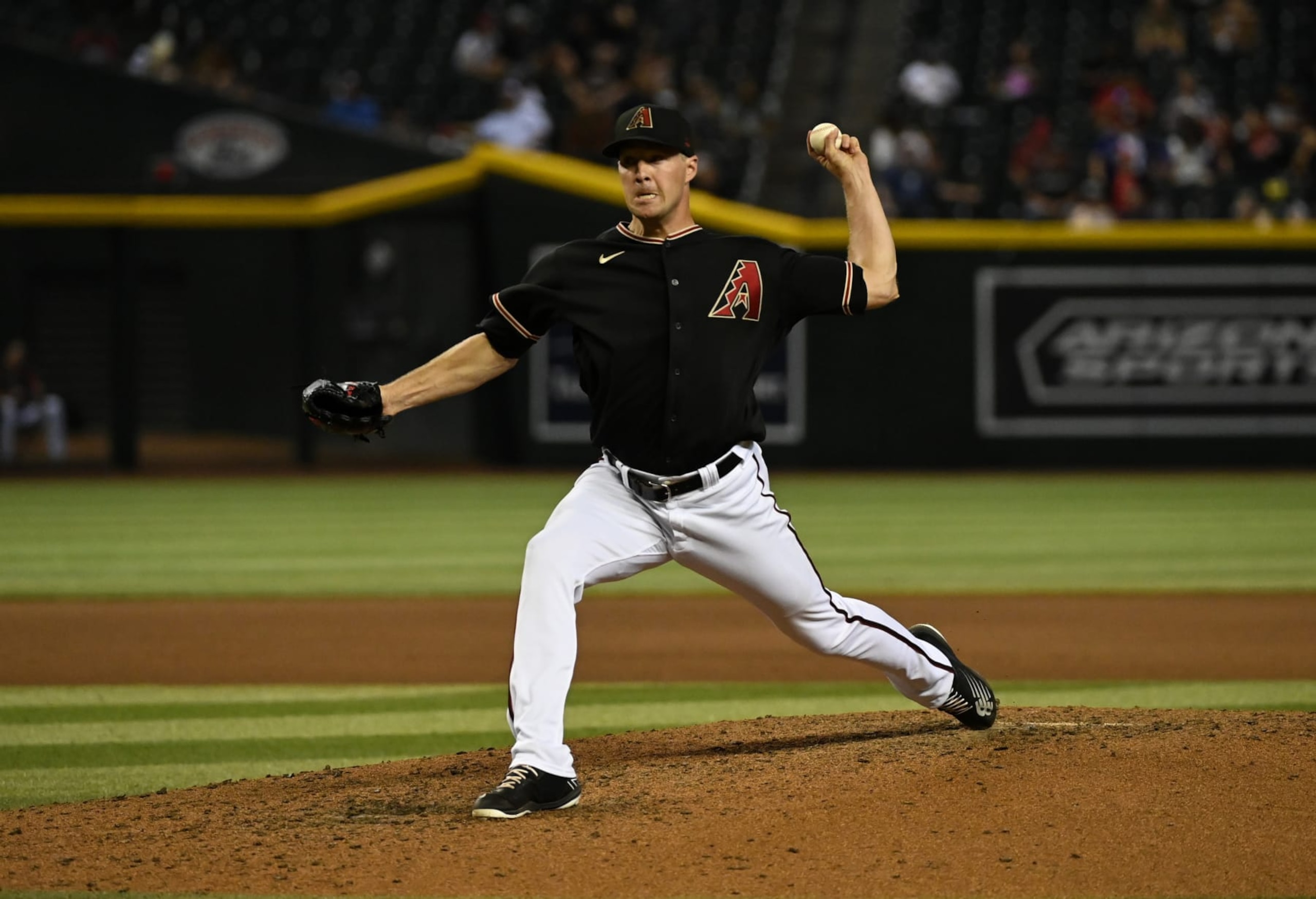 PHOENIX, ARIZONA - AUGUST 31: Joe Mantiply #35 of the Arizona Diamondbacks delivers a pitch against the Philadelphia Phillies at Chase Field on August 31, 2022 in Phoenix, Arizona. (Photo by Norm Hall/Getty Images)