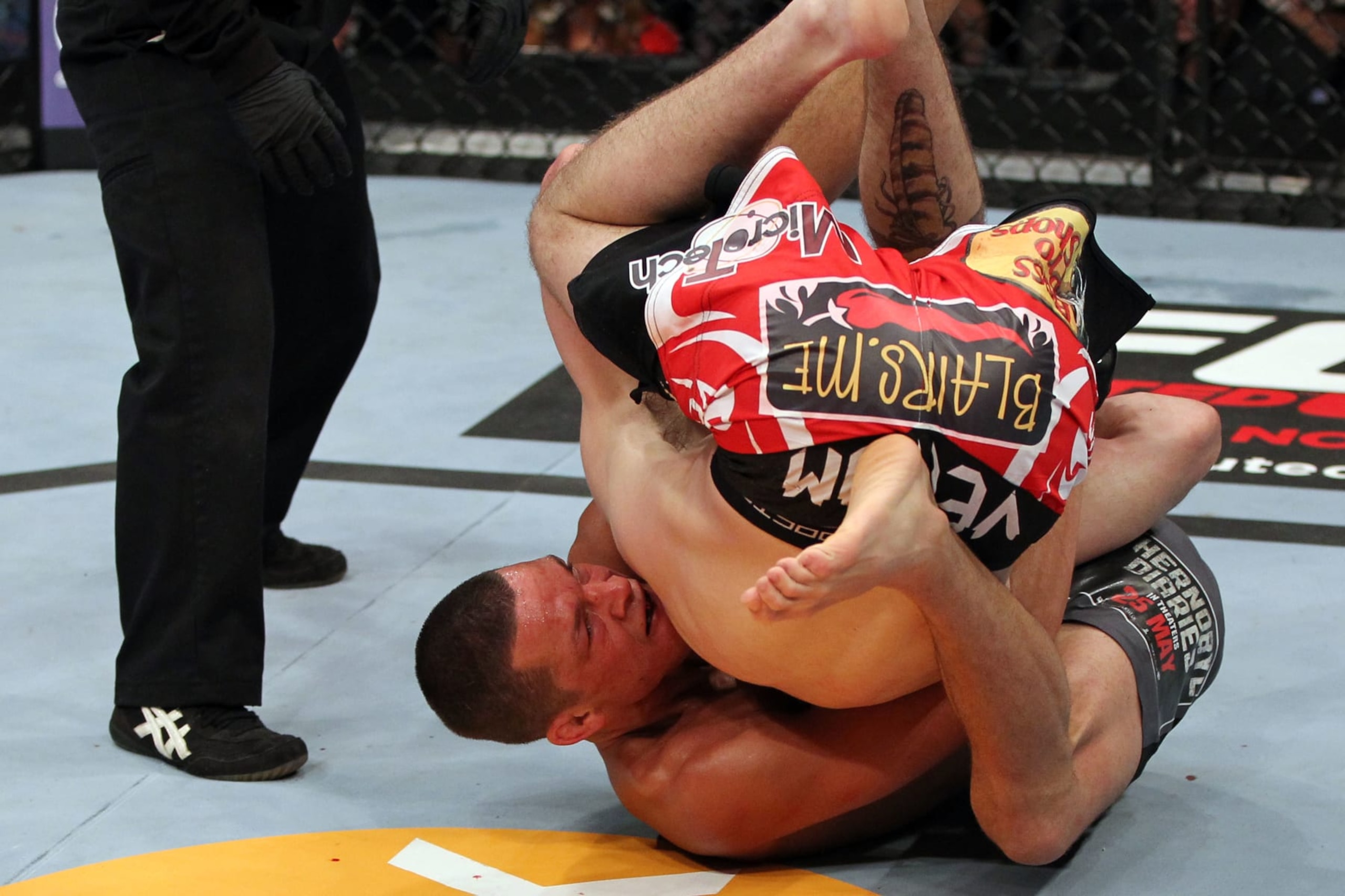 EAST RUTHERFORD, NJ - MAY 05:  Nate Diaz Takes down Jim Miller during their Lightweight bout at Izod Center on May 5, 2012 in East Rutherford, New Jersey.  (Photo by Josh Hedges/Zuffa LLC/Zuffa LLC via Getty Images)