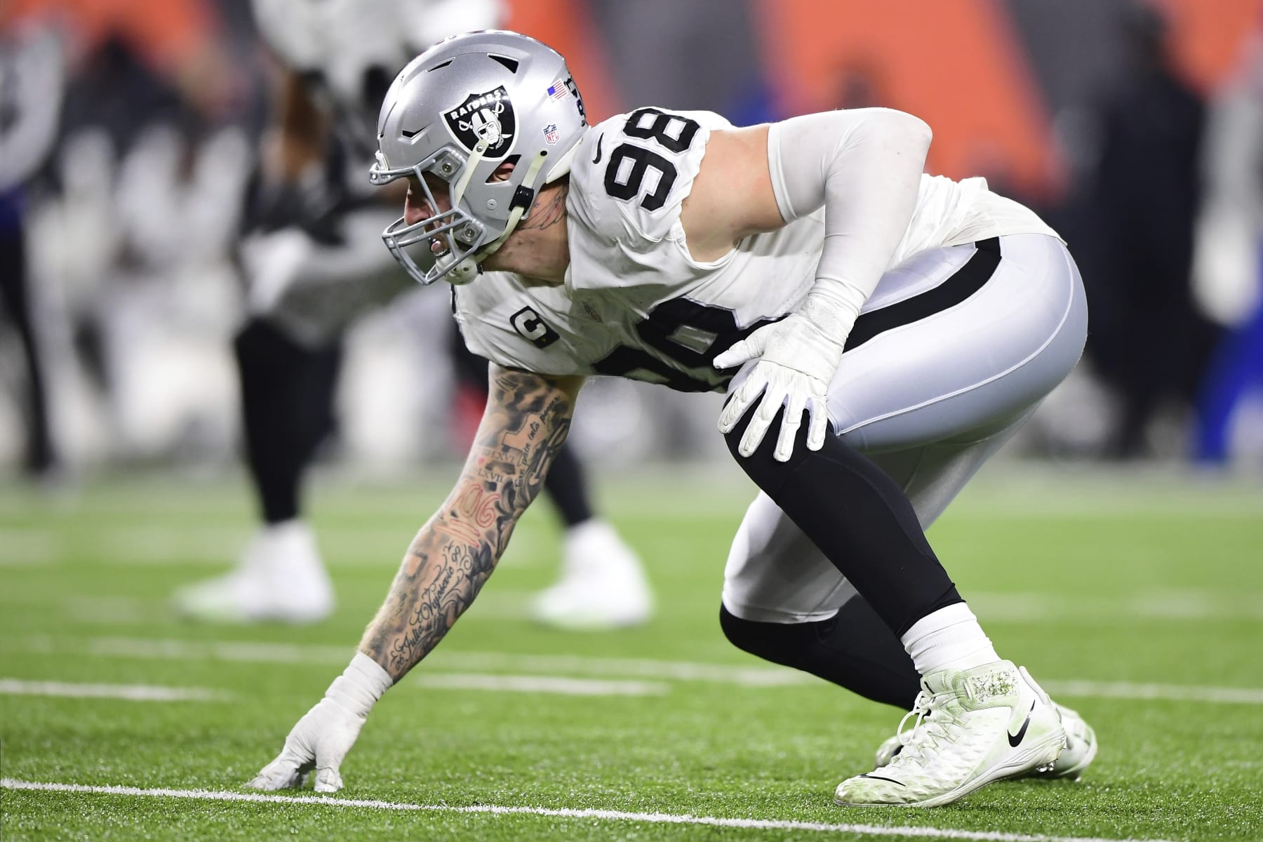Las Vegas Raiders defensive end Maxx Crosby (98) lines up for the play during an NFL wild-card playoff football game against the Cincinnati Bengals, Saturday, Jan. 15, 2022, in Cincinnati. (AP Photo/Emilee Chinn)