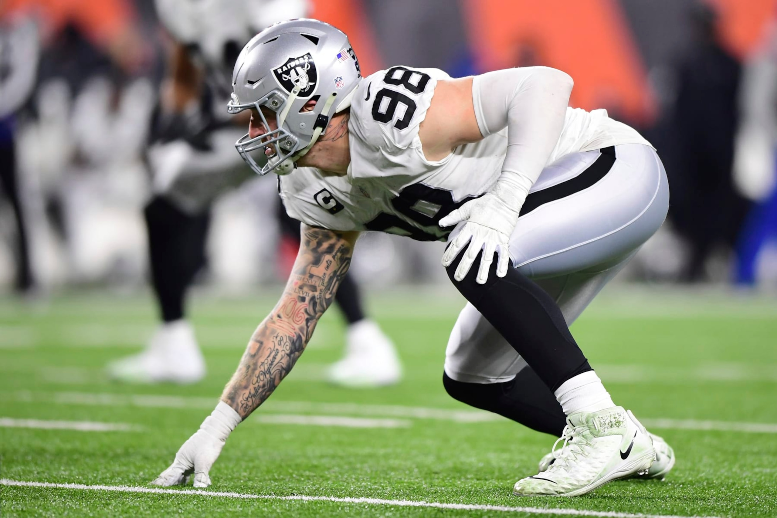 Las Vegas Raiders defensive end Maxx Crosby (98) lines up for the play during an NFL wild-card playoff football game against the Cincinnati Bengals, Saturday, Jan. 15, 2022, in Cincinnati. (AP Photo/Emilee Chinn)
