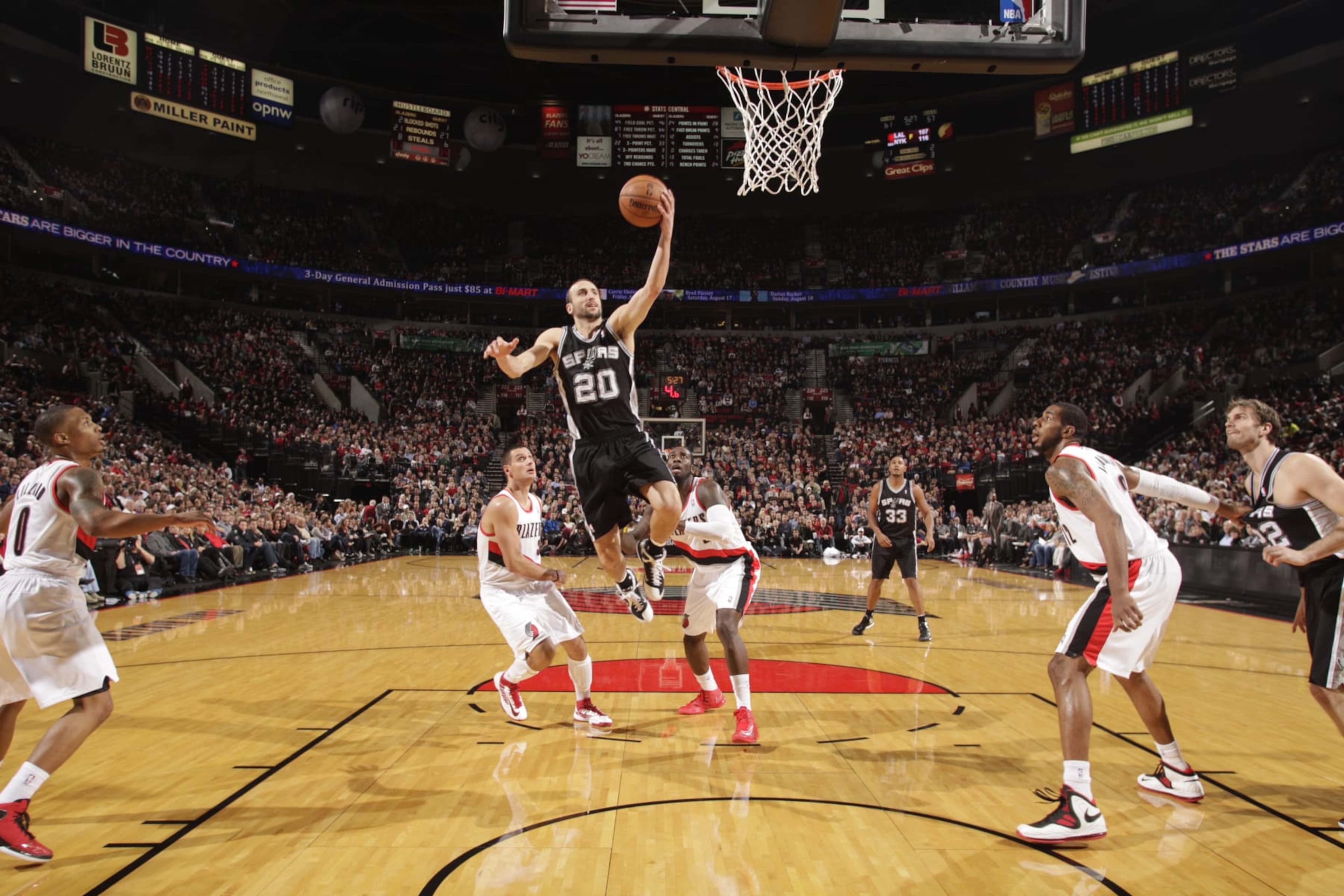 PORTLAND, OR - DECEMBER 13: Manu Ginobili #20 of the San Antonio Spurs takes the ball strong to the basket against the Portland Trailblazers on December 13, 2012 at the Rose Garden Arena in Portland, Oregon. NOTE TO USER: User expressly acknowledges and agrees that, by downloading and or using this photograph, user is consenting to the terms and conditions of the Getty Images License Agreement. Mandatory Copyright Notice: Copyright 2012 NBAE (Photo by Cameron Browne/NBAE via Getty Images) PORTLAND, OR - DECEMBER 13: Manu Ginobili #20 of the San Antonio Spurs takes the ball strong to the basket against the Portland Trailblazers on December 13, 2012 at the Rose Garden Arena in Portland, Oregon. NOTE TO USER: User expressly acknowledges and agrees that, by downloading and or using this photograph, user is consenting to the terms and conditions of the Getty Images License Agreement. Mandatory Copyright Notice: Copyright 2012 NBAE (Photo by Cameron Browne/NBAE via Getty Images)