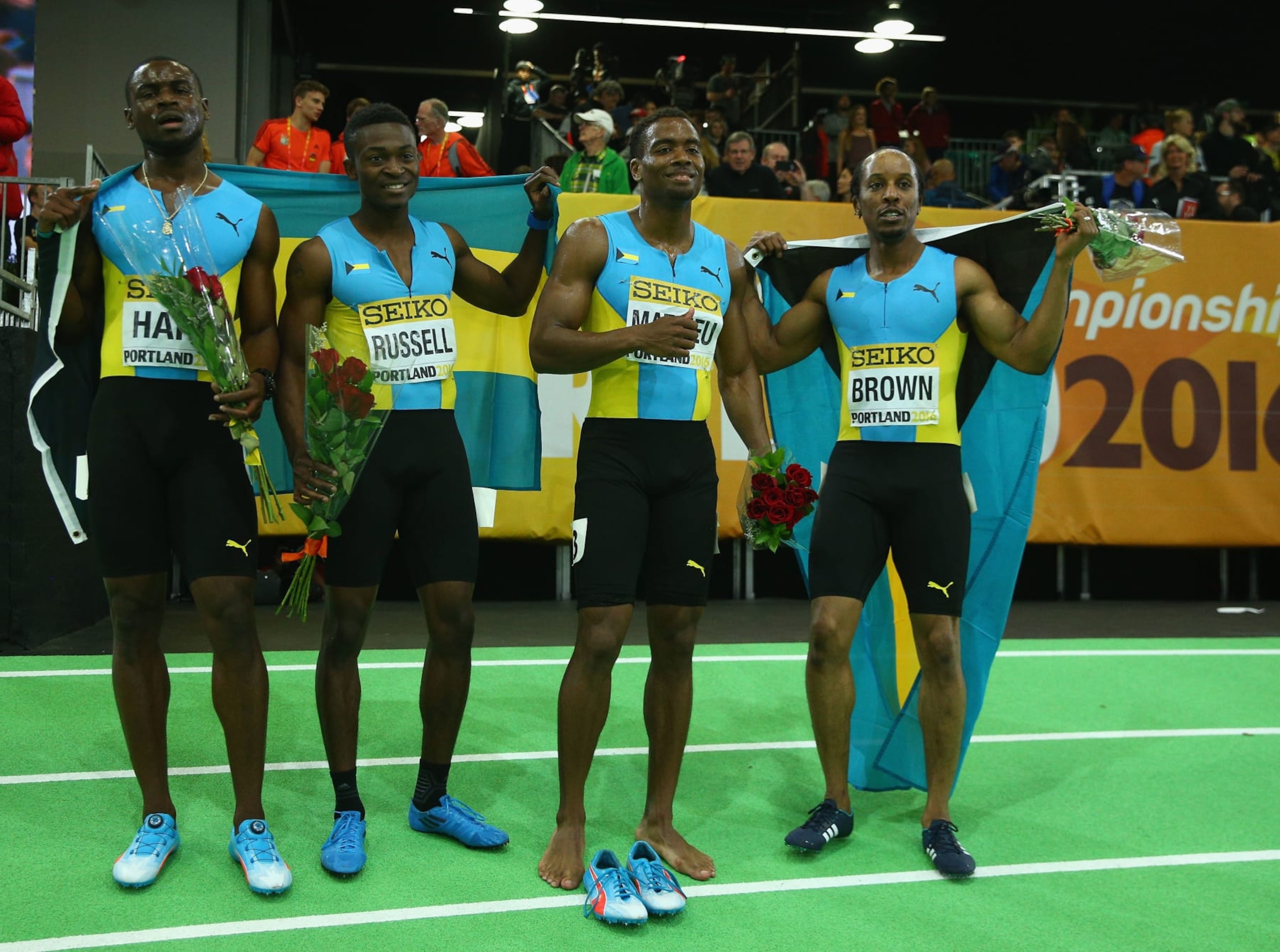 PORTLAND, OR - MARCH 20: Silver medallists Shavez Hart, Alonzo Russell, Michael Mathieu and Chris Brown of the Bahamas in the Men's 4x400 Metres Relay Final during day four of the IAAF World Indoor Championships at Oregon Convention Center on March 20, 2016 in Portland, Oregon.  (Photo by Ian Walton/Getty Images for IAAF)