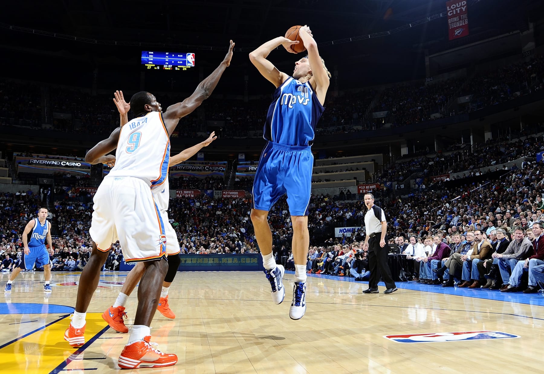 OKLAHOMA CITY, OK - DECEMBER 16:  Dirk Nowitzki #41 of the Dallas Mavericks shoots a jump shot against Serge Ibaka #9 of the Oklahoma City Thunder during the game at Ford Center on December 16, 2009 in Oklahoma City, Oklahoma.  The Mavs won 100-86.  NOTE TO USER: User expressly acknowledges and agrees that, by downloading and/or using this Photograph, user is consenting to the terms and conditions of the Getty Images License Agreement. Mandatory Copyright Notice: Copyright 2009 NBAE (Photo by Larry W. Smith/NBAE via Getty Images)