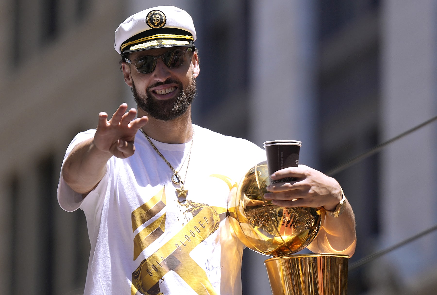 SAN FRANCISCO, CALIFORNIA - JUNE 20: Klay Thompson #11 of the Golden State Warriors celebrates with the NBA Championship Trophy during the Golden State Warriors Victory Parade on June 20, 2022 in San Francisco, California. The Golden State Warriors beat the Boston Celtics 4-2 to win the 2022 NBA Finals. NOTE TO USER: User expressly acknowledges and agrees that, by downloading and or using this photograph, User is consenting to the terms and conditions of the Getty Images License Agreement. (Photo by Thearon W. Henderson/Getty Images)(Photo by Thearon W. Henderson/Getty Images)