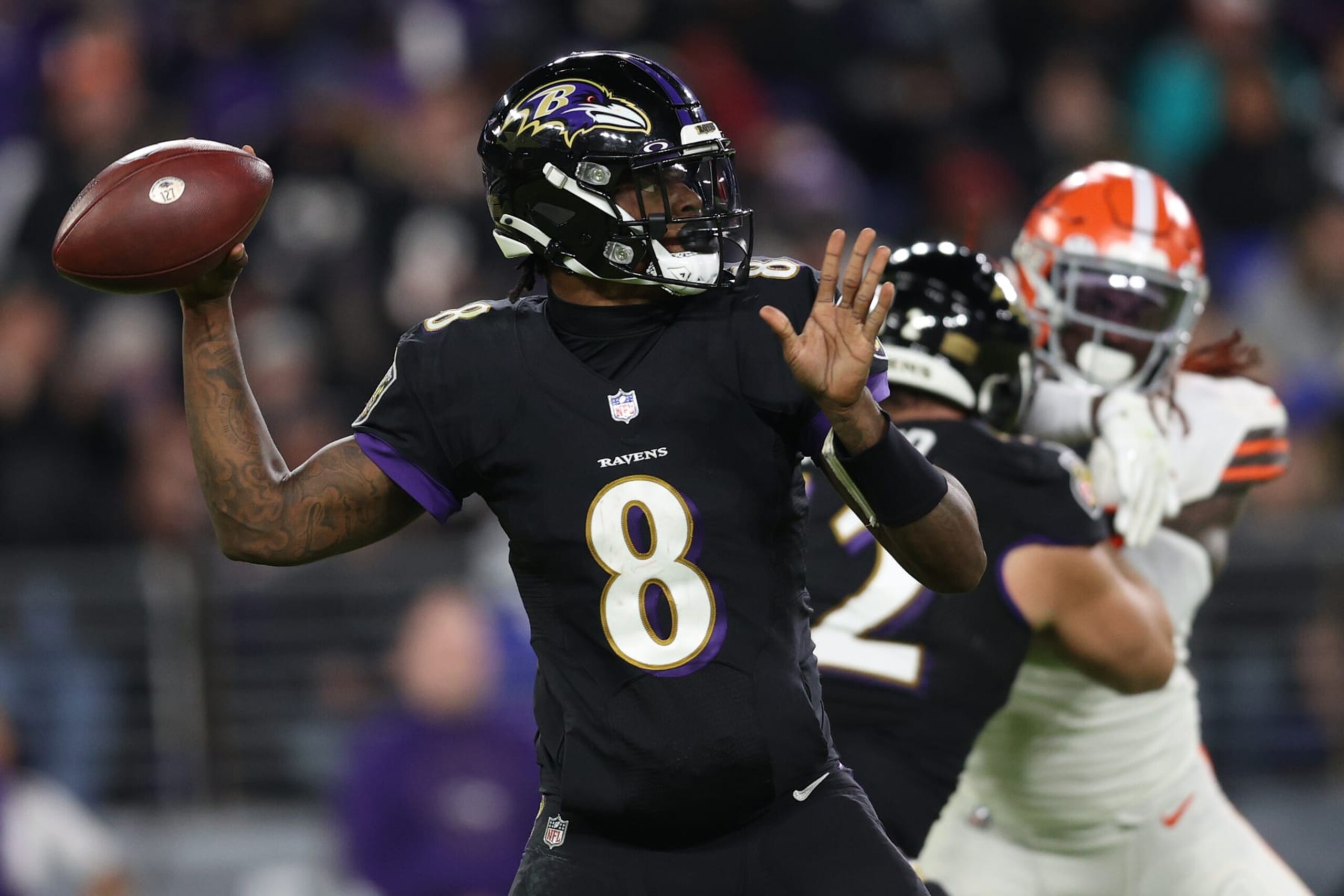 BALTIMORE, MARYLAND - NOVEMBER 28: Quarterback Lamar Jackson #8 of the Baltimore Ravens passes the ball against the Cleveland Browns at M&T Bank Stadium on November 28, 2021 in Baltimore, Maryland. (Photo by Patrick Smith/Getty Images)