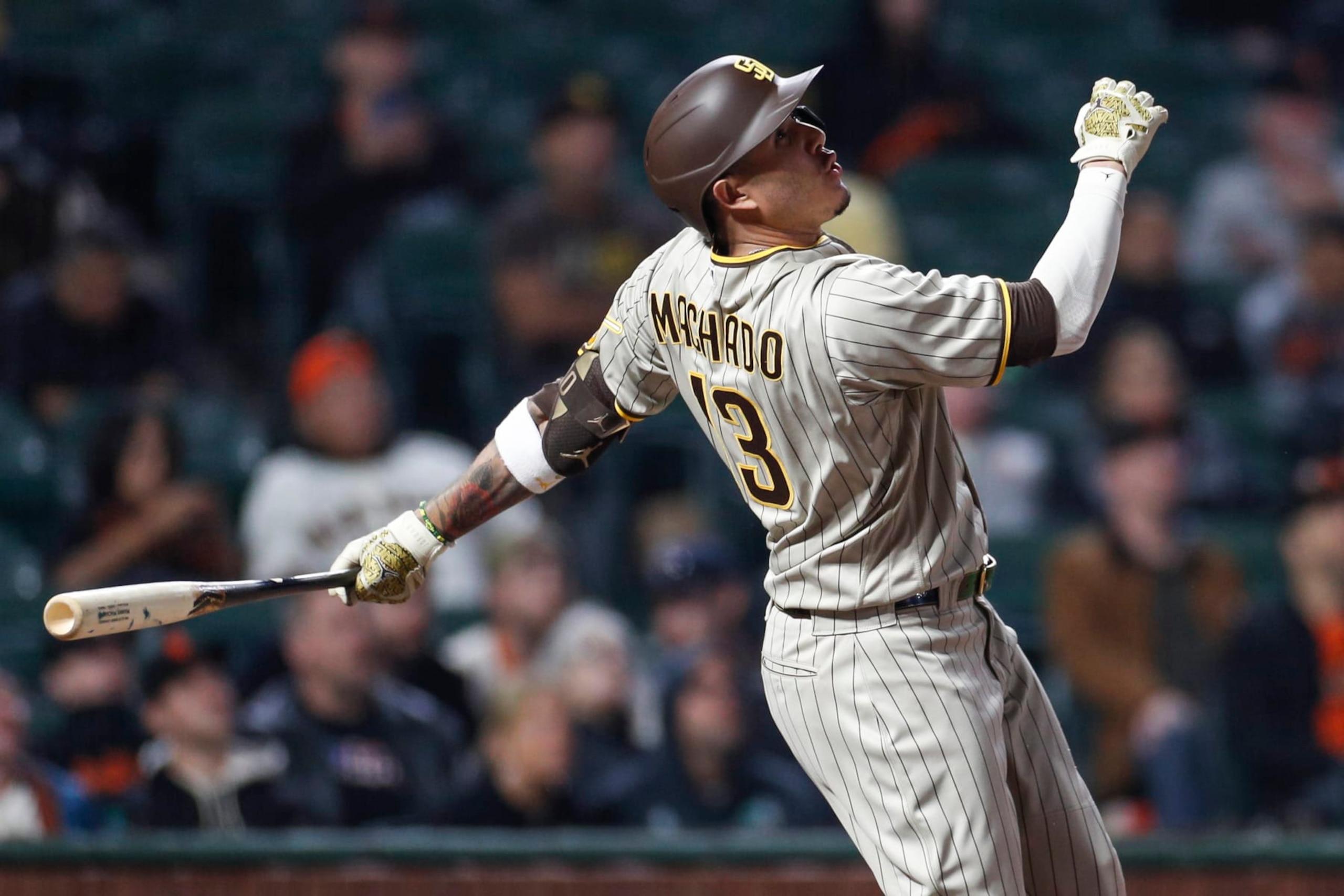 SAN FRANCISCO, CA - AUGUST 29: San Diego Padres third baseman Manny Machado (13) watches his ball in flight in the seventh inning during a game between the San Diego Padres and San Francisco Giants on August 29, 2022, at Oracle Park in San Francisco, CA. (Photo by Brandon Sloter/Icon Sportswire via Getty Images)