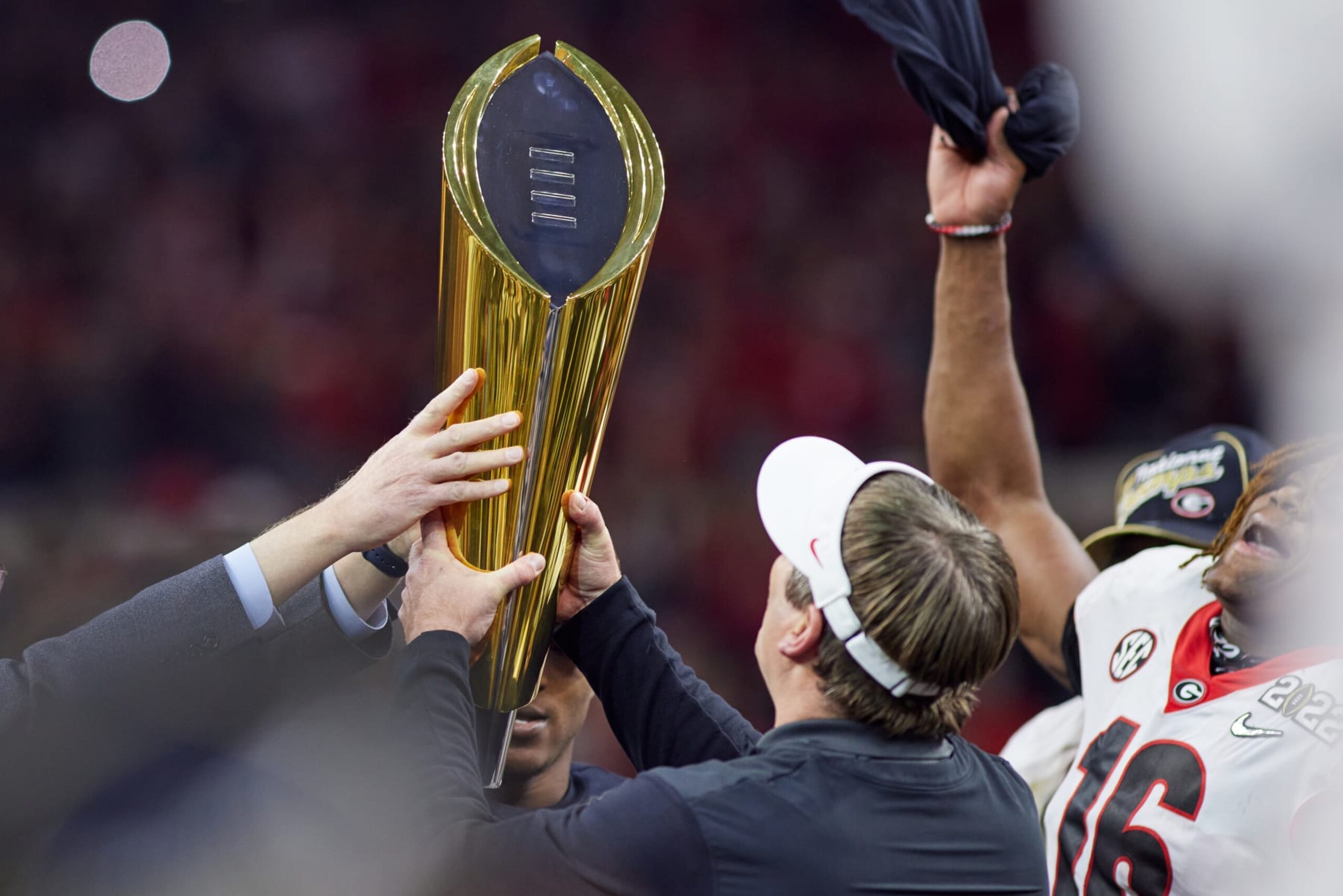 INDIANAPOLIS, IN - JANUARY 10: Georgia Bulldogs head coach Kirby Smart holds the national championship trophy after the Alabama Crimson Tide versus the Georgia Bulldogs in the College Football Playoff National Championship, on January 10, 2022, at Lucas Oil Stadium in Indianapolis, IN.(Photo by Robin Alam/Icon Sportswire via Getty Images) INDIANAPOLIS, IN - JANUARY 10: Georgia Bulldogs head coach Kirby Smart holds the national championship trophy after the Alabama Crimson Tide versus the Georgia Bulldogs in the College Football Playoff National Championship, on January 10, 2022, at Lucas Oil Stadium in Indianapolis, IN.(Photo by Robin Alam/Icon Sportswire via Getty Images)