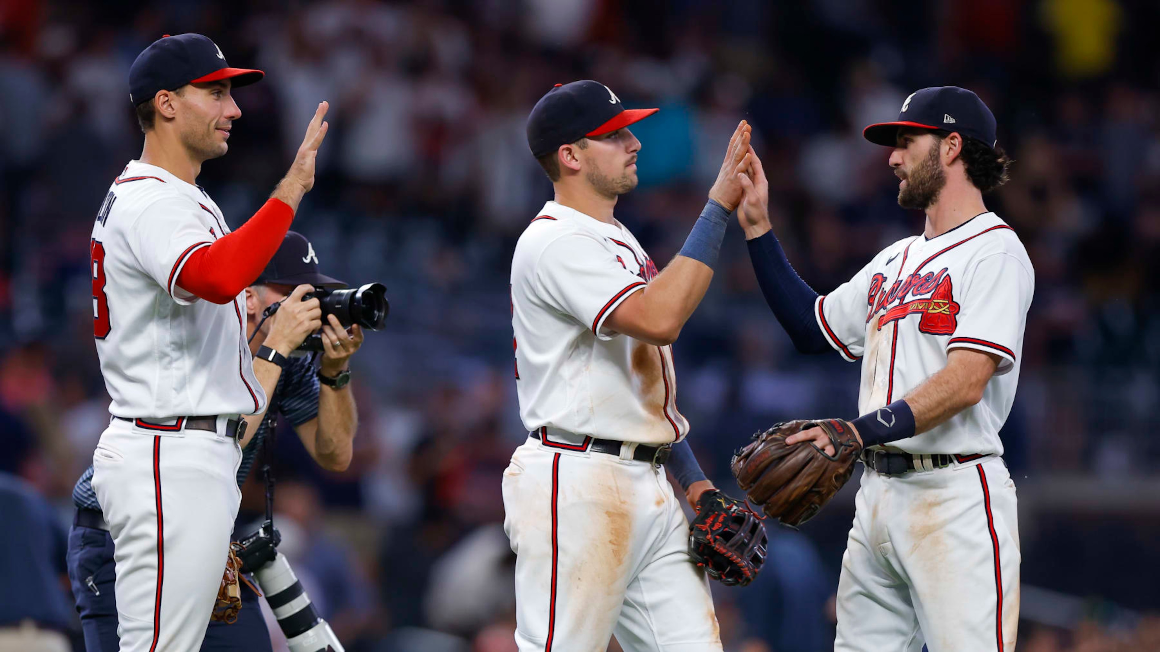 ATLANTA, GA - AUGUST 31: Matt Olson #28, Austin Riley #27 and Dansby Swanson #7 of the Atlanta Braves celebrate their 3-2 victory over the Colorado Rockies at Truist Park on August 31, 2022 in Atlanta, Georgia. (Photo by Todd Kirkland/Getty Images) ATLANTA, GA - AUGUST 31: Matt Olson #28, Austin Riley #27 and Dansby Swanson #7 of the Atlanta Braves celebrate their 3-2 victory over the Colorado Rockies at Truist Park on August 31, 2022 in Atlanta, Georgia. (Photo by Todd Kirkland/Getty Images)