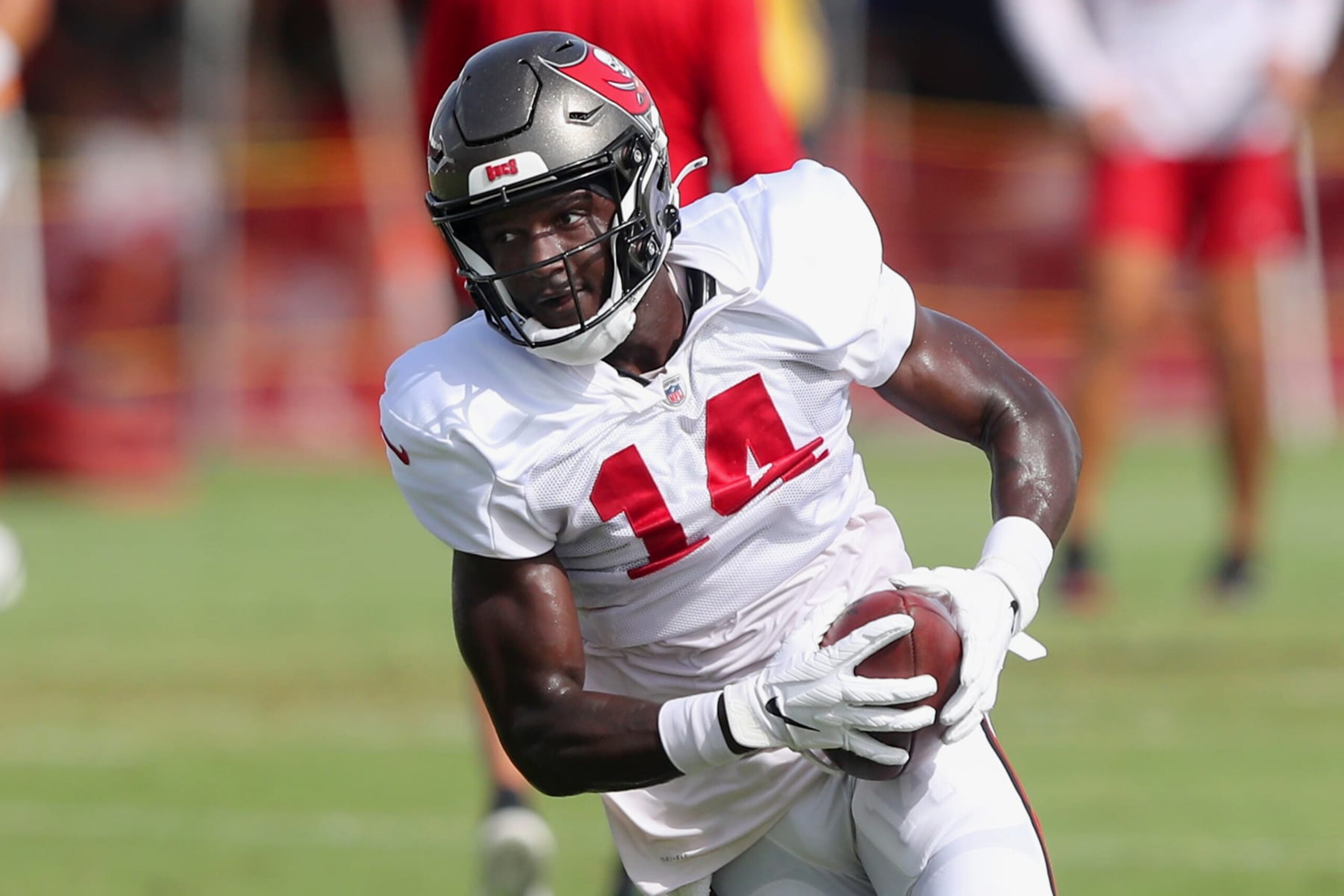 TAMPA, FL - AUG 10: Tampa Bay Buccaneers wide receiver Chris Godwin (14) runs with the ball after making catch during the Tampa Bay Buccaneers & Miami Dolphins Joint-Practice on August 10, 2022 at the AdventHealth Training Center at One Buccaneer Place in Tampa, Florida. (Photo by Cliff Welch/Icon Sportswire via Getty Images)