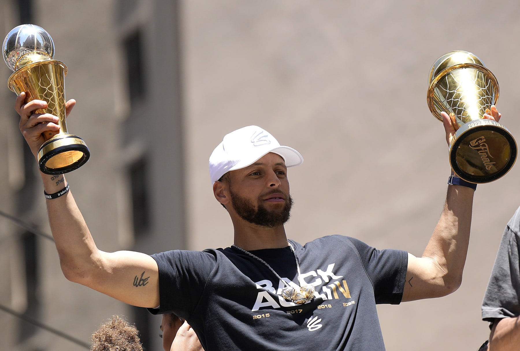 SAN FRANCISCO, CALIFORNIA - JUNE 20: Stephen Curry #30 of the Golden State Warriors celebrates with his NBA Finals Most Valuable Player Award during the Golden State Warriors Victory Parade on June 20, 2022 in San Francisco, California. The Golden State Warriors beat the Boston Celtics 4-2 to win the 2022 NBA Finals. NOTE TO USER: User expressly acknowledges and agrees that, by downloading and or using this photograph, User is consenting to the terms and conditions of the Getty Images License Agreement. (Photo by Thearon W. Henderson/Getty Images)(Photo by Thearon W. Henderson/Getty Images)