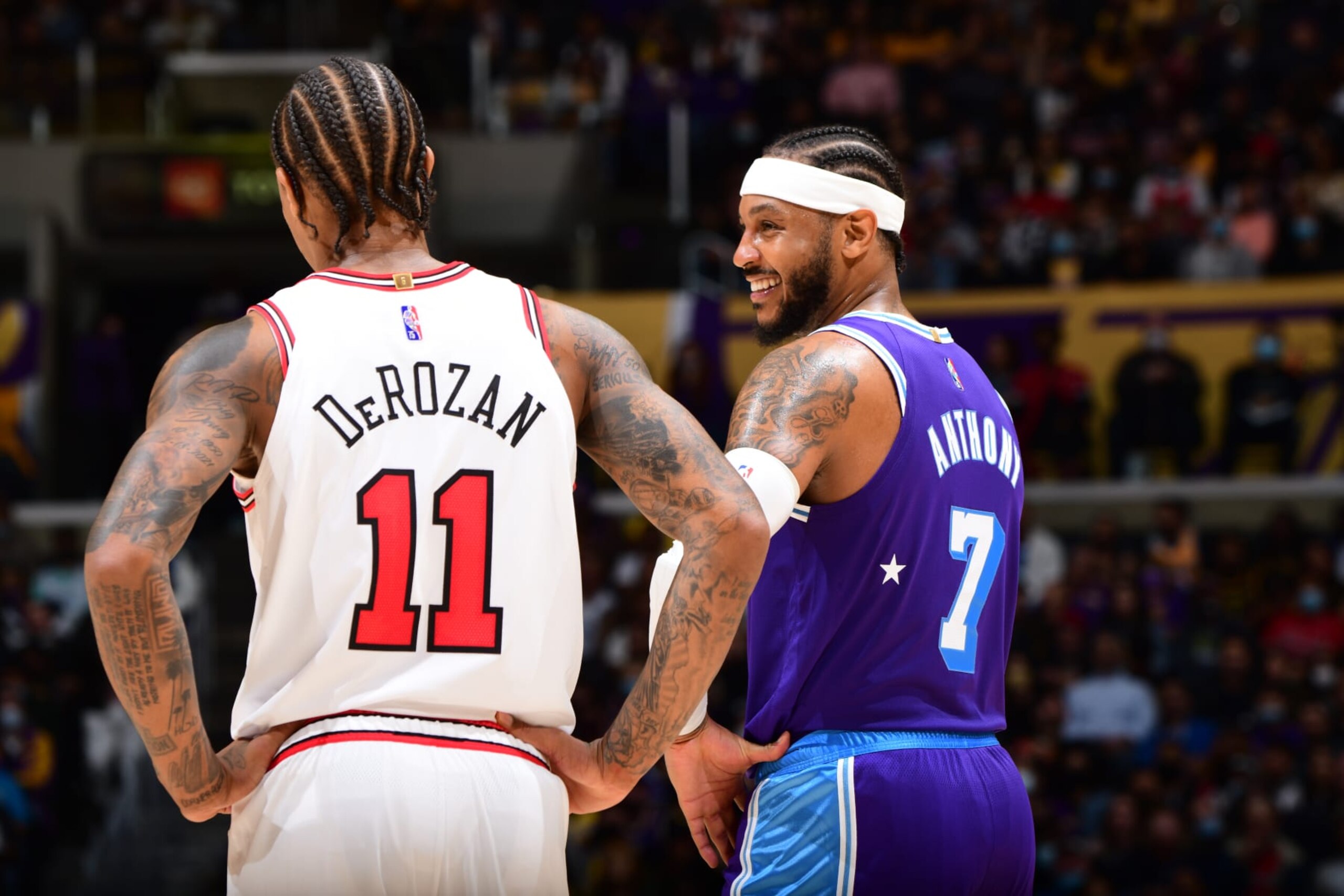 LOS ANGELES, CA - NOVEMBER 15: DeMar DeRozan #11 of the Chicago Bulls and Carmelo Anthony #7 of the Los Angeles Lakers talk during the game on November 15, 2021 at STAPLES Center in Los Angeles, California. NOTE TO USER: User expressly acknowledges and agrees that, by downloading and/or using this Photograph, user is consenting to the terms and conditions of the Getty Images License Agreement. Mandatory Copyright Notice: Copyright 2021 NBAE (Photo by Adam Pantozzi/NBAE via Getty Images)