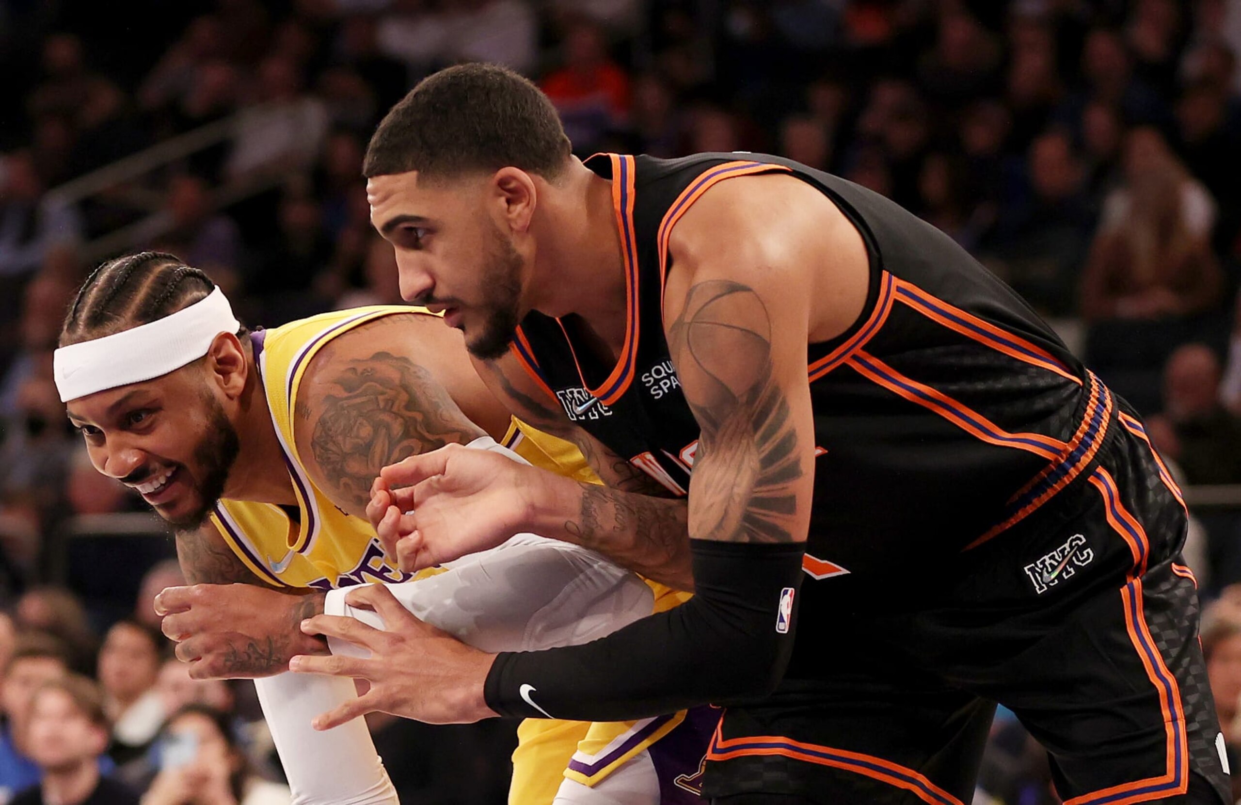 NEW YORK, NEW YORK - NOVEMBER 23:  Obi Toppin #1 of the New York Knicks and Carmelo Anthony #7 of the Los Angeles Lakers fight for position at Madison Square Garden on November 23, 2021 in New York City. NOTE TO USER: User expressly acknowledges and agrees that, by downloading and or using this photograph, User is consenting to the terms and conditions of the Getty Images License Agreement. (Photo by Elsa/Getty Images)