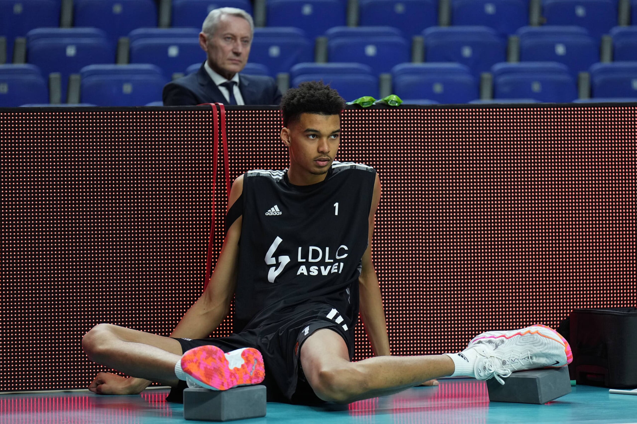 MADRID, SPAIN - MARCH 17: Victor Wembanyama, #1 of LDLC Asvel Villeurbanne stretches prior to the Turkish Airlines EuroLeague match between Real Madrid and LDLC Asvel Villeurbanne at Wizink Center on March 17, 2022 in Madrid, Spain. (Photo by Angel Martinez/Euroleague Basketball via Getty Images)