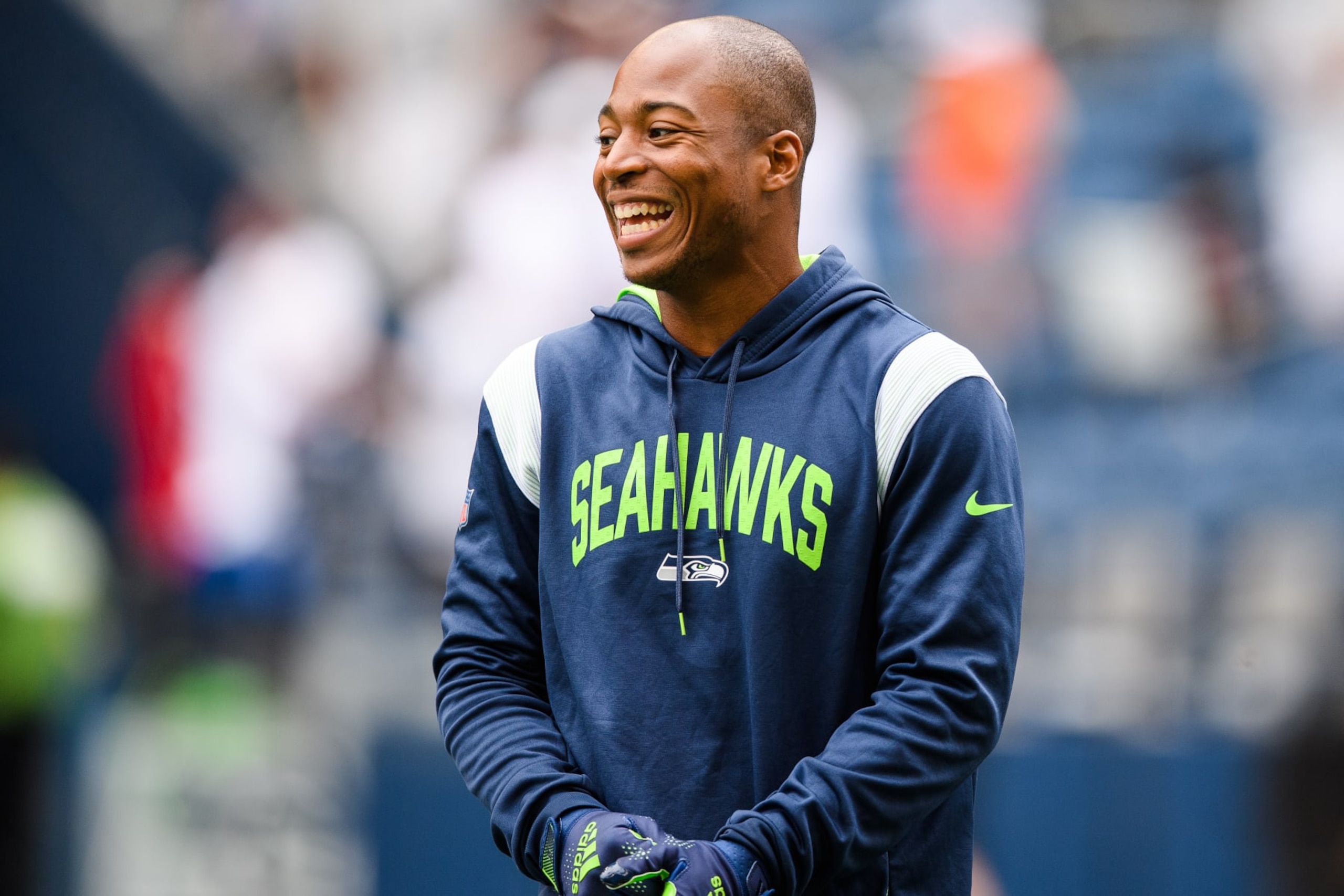 SEATTLE, WASHINGTON - AUGUST 18: Tyler Lockett #16 of the Seattle Seahawks smiles prior to the preseason game against the Chicago Bears at Lumen Field on August 18, 2022 in Seattle, Washington. (Photo by Jane Gershovich/Getty Images)