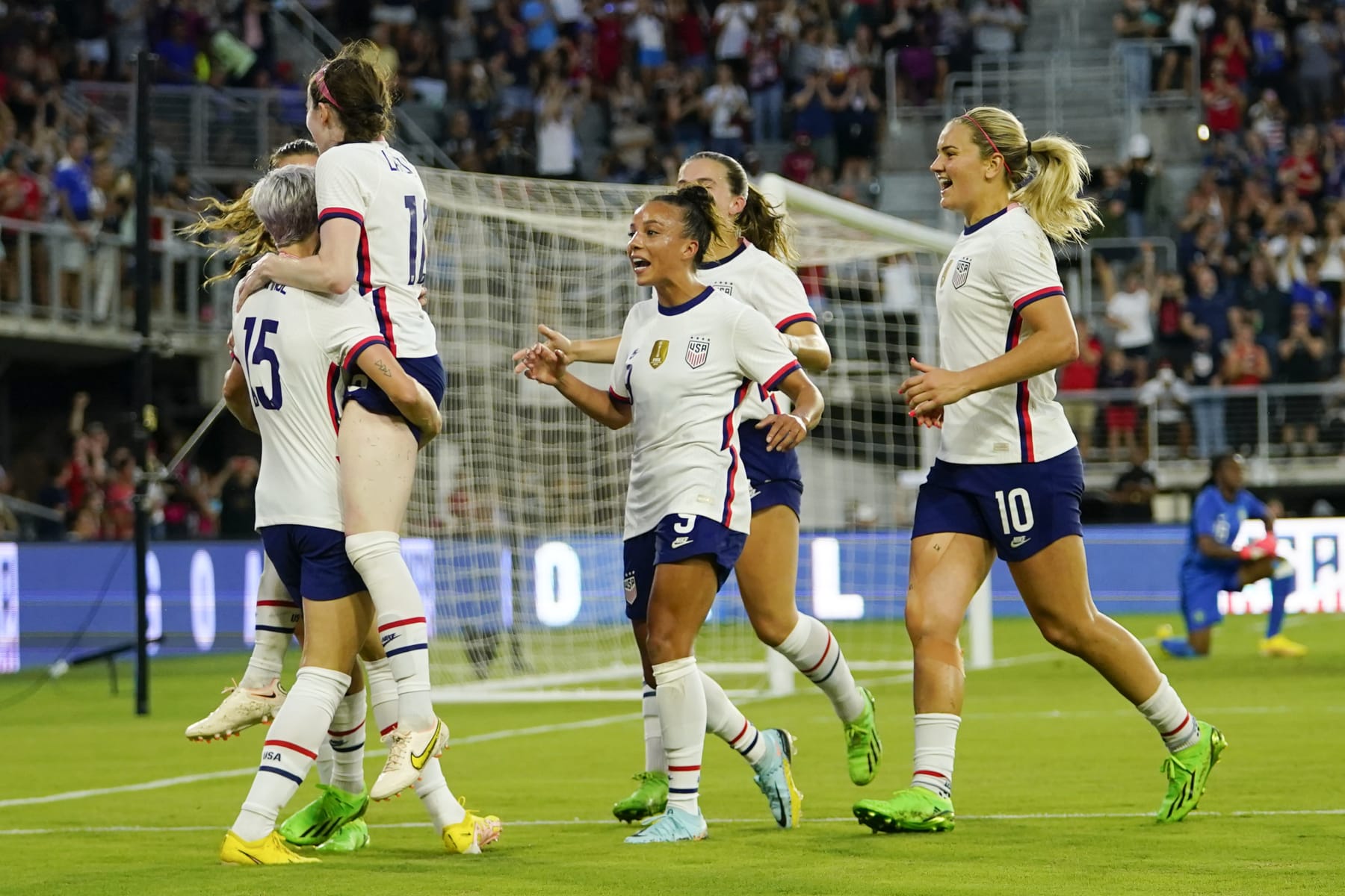 United States players celebrate a goal by Rose Lavelle, second from left, against Nigeria during the second half of an international friendly soccer match, Tuesday, Sept. 6, 2022, in Washington. (AP Photo/Julio Cortez)