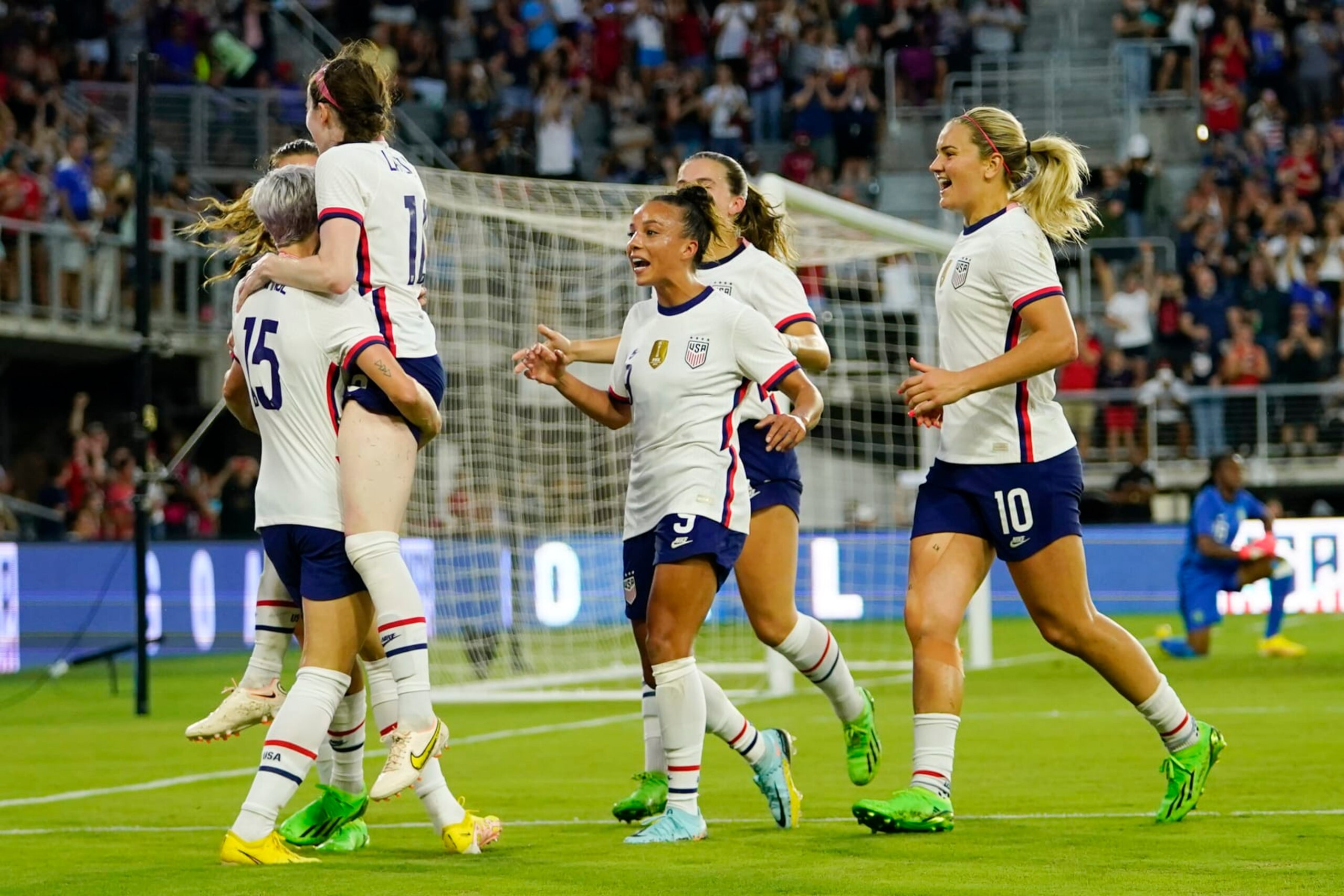 United States players celebrate a goal by Rose Lavelle, second from left, against Nigeria during the second half of an international friendly soccer match, Tuesday, Sept. 6, 2022, in Washington. (AP Photo/Julio Cortez)