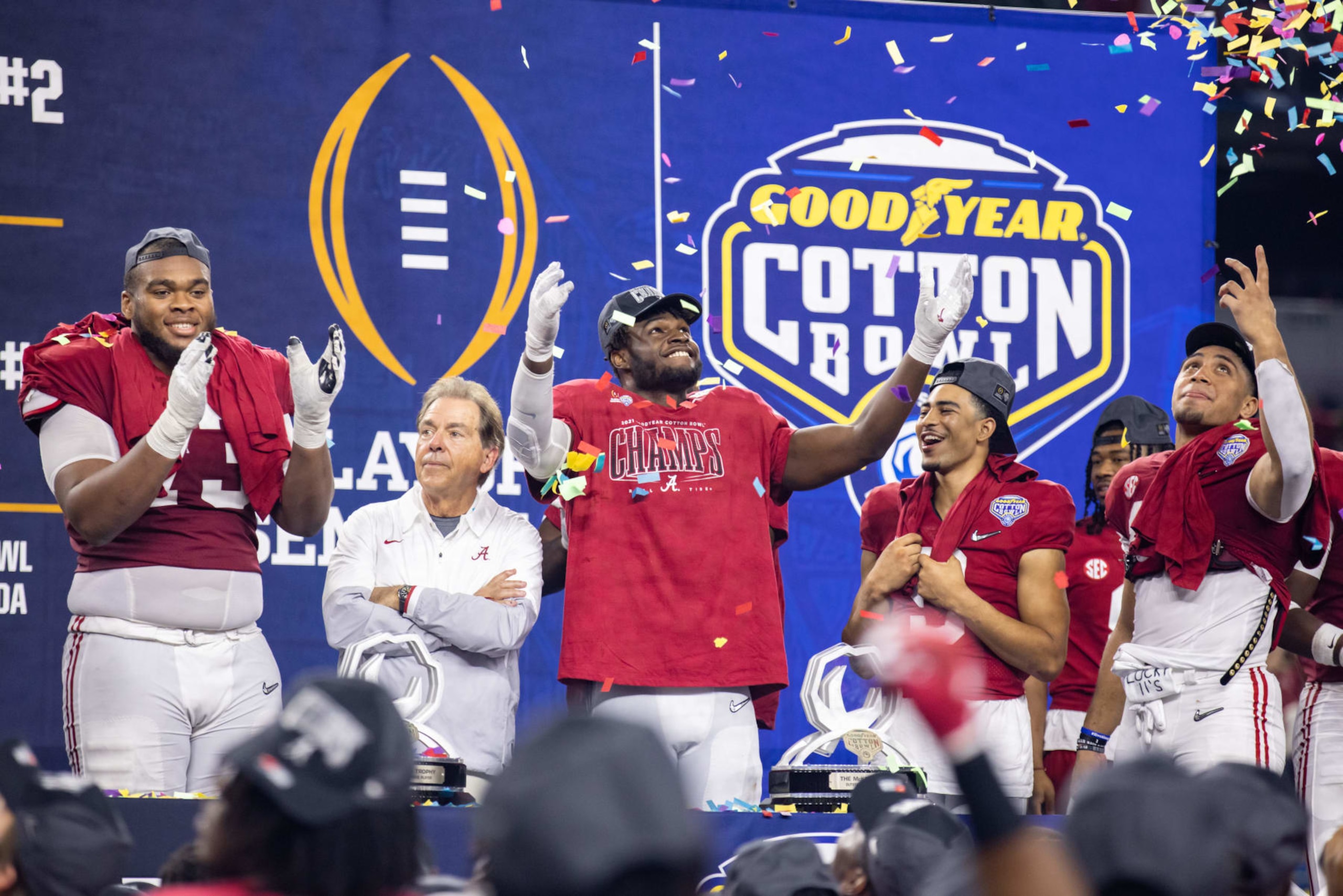 ARLINGTON, TX - DECEMBER 31: Alabama Crimson Tide offensive tackle Evan Neal (#73), head coach Nick Saban, linebacker Will Anderson Jr. (#31), quarterback Bryce Young (#9), and Alabama Crimson Tide linebacker Henry To'o To'o (#10) celebrate during the trophy presentation during Goodyear Cotton Bowl CFP Semifinal college football game between the Alabama Crimson Tide and the Cincinnati Bearcats on December 31, 2021 at AT&T Stadium in Arlington, Texas.  (Photo by Matthew Visinsky/Icon Sportswire via Getty Images)