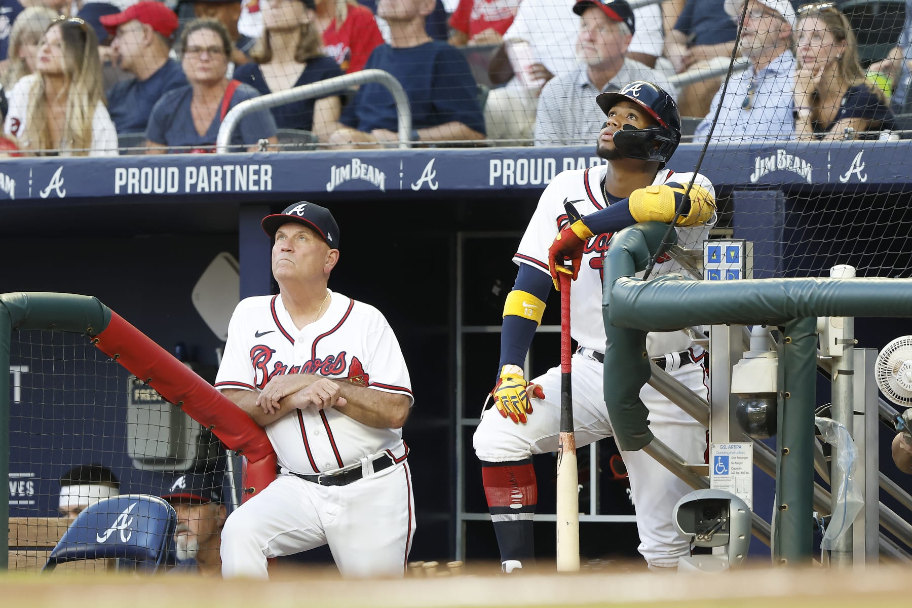 ATLANTA, GA - AUGUST 31: Atlanta Braves manager Brian Snitker (43) and Braves right fielder Ronald Acuna, Jr. (13) watch the popup fly ball of Atlanta Braves right fielder Eddie Rosario (not seen) during the Wednesday evening MLB game between the Atlanta Braves and the Colorado Rockies on August 31, 2022 at Truist Park in Atlanta, Georgia.  (Photo by David J. Griffin/Icon Sportswire via Getty Images)