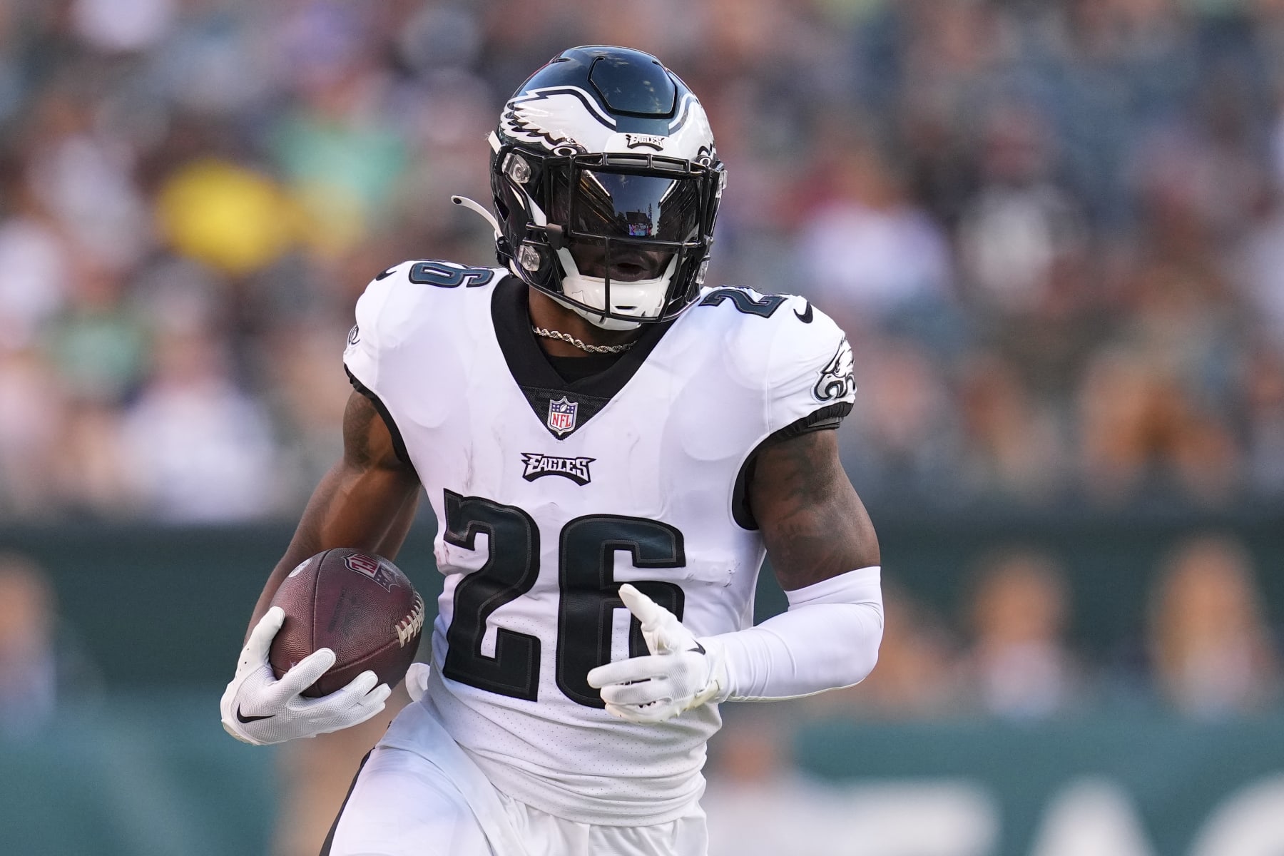 PHILADELPHIA, PA - AUGUST 12: Miles Sanders #26 of the Philadelphia Eagles runs with the ball against the New York Jets during the preseason game at Lincoln Financial Field on August 12, 2022 in Philadelphia, Pennsylvania. The Jets defeated the Eagles 24-21. (Photo by Mitchell Leff/Getty Images)