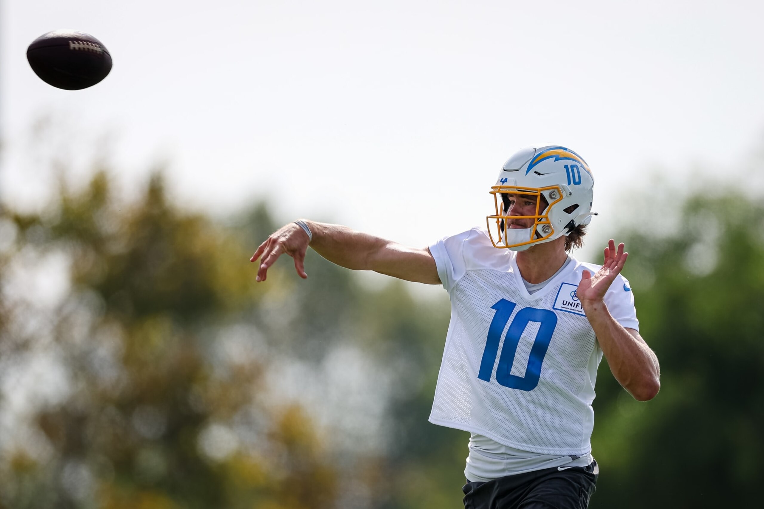 COSTA MESA, CA - JULY 27: Justin Herbert #10 of the Los Angeles Chargers attempts a pass during training camp at Jack Hammett Sports Complex on July 27, 2022 in Costa Mesa, California. (Photo by Scott Taetsch/Getty Images)