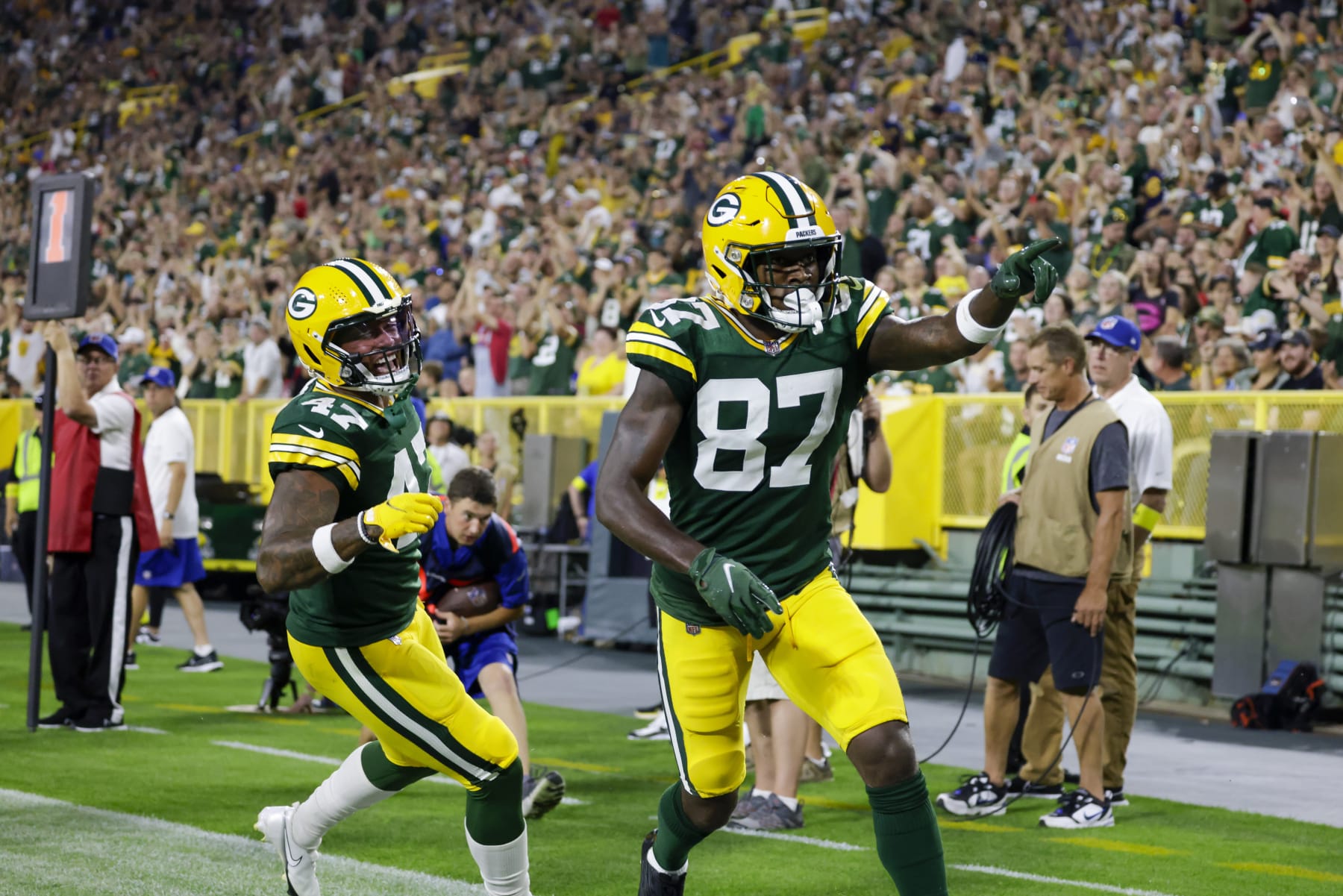 Green Bay Packers wide receiver Romeo Doubs (87) and tight end Alize Mack (47) celebrate a touchdown against the New Orleans Saints during a preseason NFL football game Friday, Aug. 19, 2022, in Green Bay, Wis. (AP Photo/Matt Ludtke)