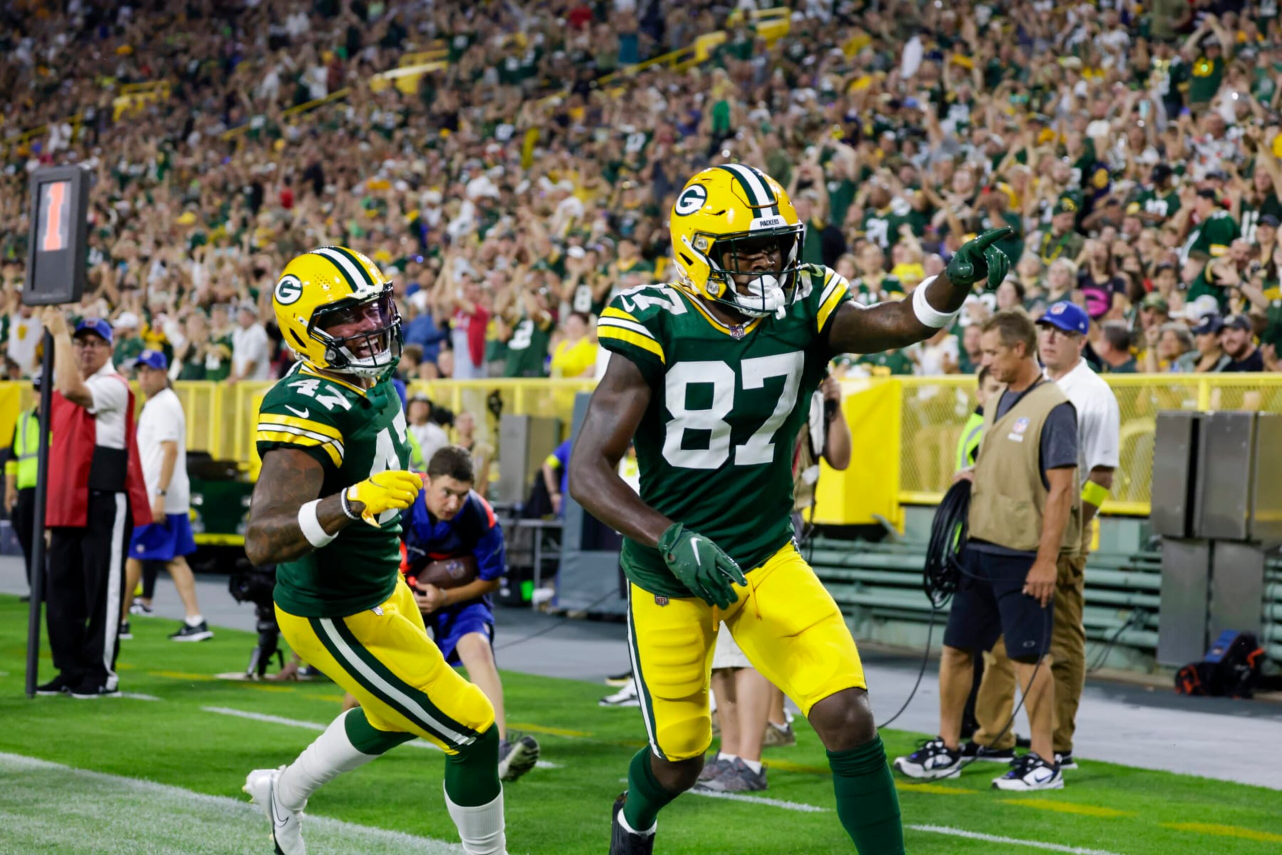 Green Bay Packers wide receiver Romeo Doubs (87) and tight end Alize Mack (47) celebrate a touchdown against the New Orleans Saints during a preseason NFL football game Friday, Aug. 19, 2022, in Green Bay, Wis. (AP Photo/Matt Ludtke) Green Bay Packers wide receiver Romeo Doubs (87) and tight end Alize Mack (47) celebrate a touchdown against the New Orleans Saints during a preseason NFL football game Friday, Aug. 19, 2022, in Green Bay, Wis. (AP Photo/Matt Ludtke)