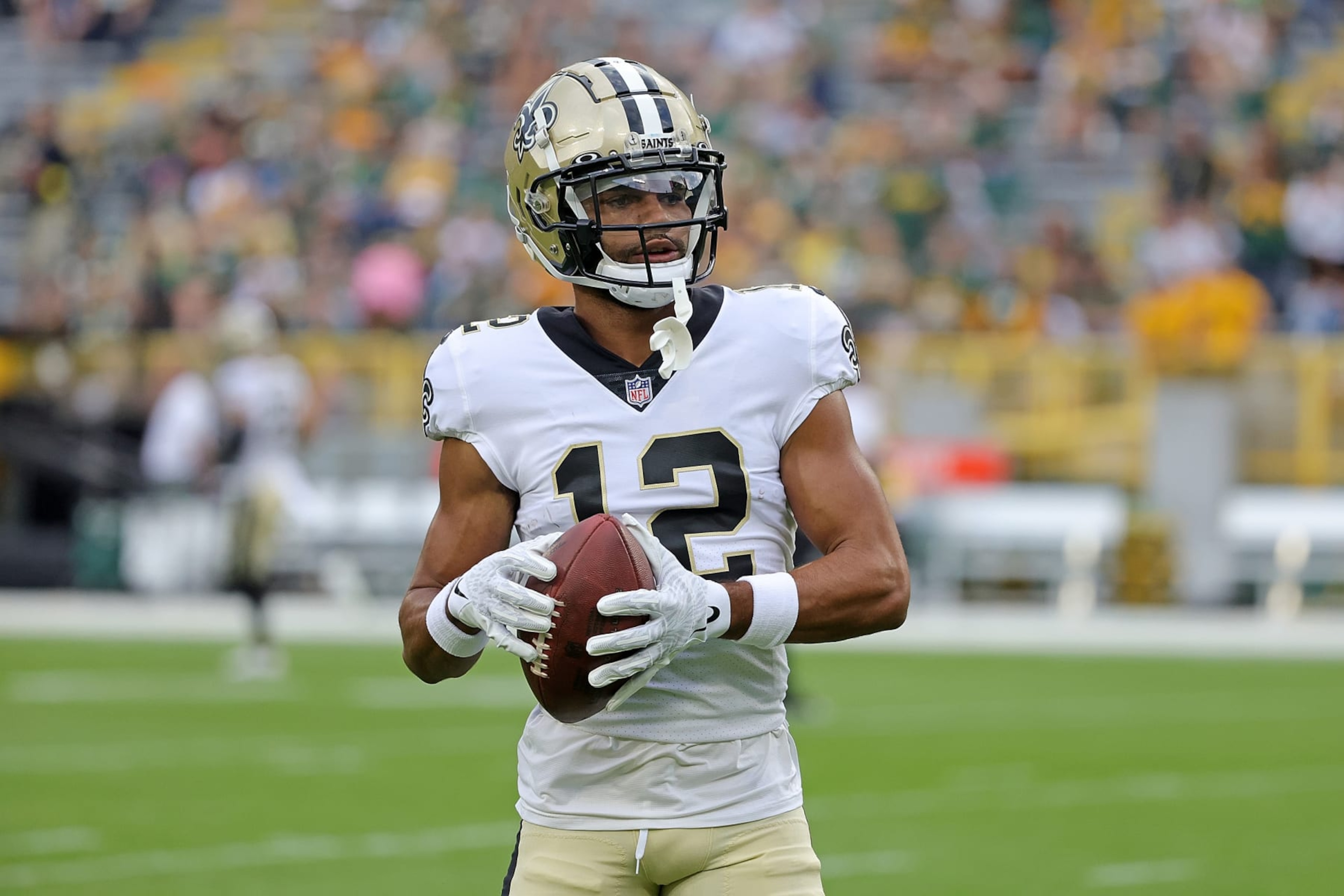GREEN BAY, WISCONSIN - AUGUST 19: Chris Olave #12 of the New Orleans Saints participates in warmups prior to a preseason game against the Green Bay Packers at Lambeau Field on August 19, 2022 in Green Bay, Wisconsin. (Photo by Stacy Revere/Getty Images) GREEN BAY, WISCONSIN - AUGUST 19: Chris Olave #12 of the New Orleans Saints participates in warmups prior to a preseason game against the Green Bay Packers at Lambeau Field on August 19, 2022 in Green Bay, Wisconsin. (Photo by Stacy Revere/Getty Images)